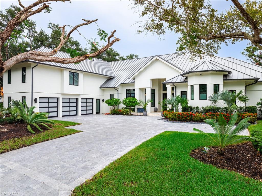 Introducing a luxurious retreat nestled within the prestigious Pelican Bay community, this exceptional Waterford estate home offers an unparalleled blend of sophistication and comfort. Recently renovated in 2022 and more updates in 2025, this sprawling residence spans over 6000 square feet across two impeccably designed stories. Featuring 6 bedrooms and 6.5 bathrooms, every corner of this home exudes elegance and attention to detail. Step inside to discover a grand formal dining area, a captivating glassed wine cellar, and a chef's kitchen seamlessly connected to a cozy breakfast room. The family room boasts a sleek linear fireplace, while the formal living room provides tranquil views of the pool, spa, and water feature. Exit outdoors to an expansive oasis, complete with a covered patio, stone pool deck, and deluxe summer kitchen – the perfect setting for hosting unforgettable gatherings. The primary suite offers a sanctuary of relaxation with its spacious his and her bath area and walk-in closets. Additional highlights include an office, fitness room (or bedroom), ground floor guest suites, and a three-car garage. Ascend the stairs to the second level, where a second master suite awaits along with two private guest suites. Residents of this esteemed community will enjoy exclusive access to Pelican Bay's world-class amenities, including private beach clubs, a tennis complex, spa, fitness center, multiple dining options, and golf. Discover the epitome of luxury living in this meticulously crafted Waterford estate, where every detail is designed to elevate your lifestyle and create lasting memories.