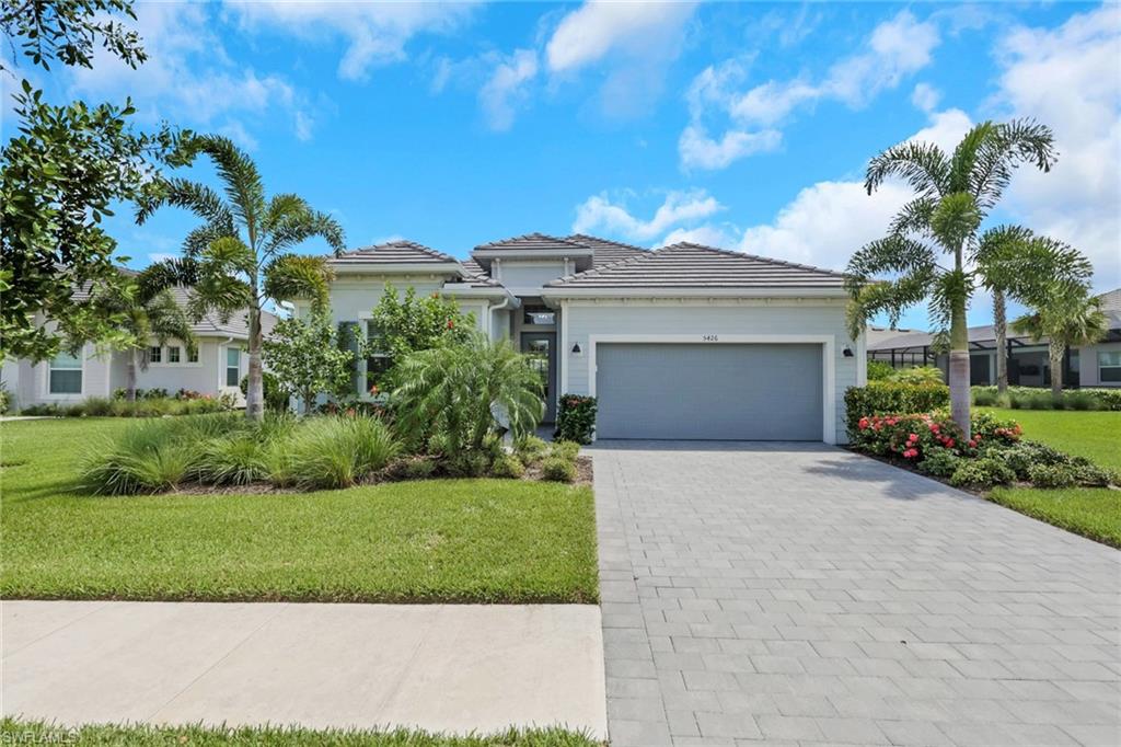 Welcome to luxury resort-style living in The National Golf & Country Club at Ave Maria! Built in 2024, this beautifully designed 3-bedroom plus den, 3-bath residence offers the perfect blend of modern elegance, comfort, and an unbeatable lifestyle.

Step inside to discover an open-concept floor plan featuring tile flooring throughout the entire home, creating a seamless and sophisticated look. The bright kitchen is thoughtfully designed with stylish cabinetry, sleek countertops, stainless steel appliances, and contemporary finishes that flow effortlessly into the spacious living and dining areas. Each bathroom showcases modern designer touches, providing both modern design and functionality. The versatile den is ideal for a home office, media room, or guest space, while the 2-car garage provides ample storage.

Outdoor living is truly exceptional with a screened lanai featuring a heated pool and spa, where you can relax while enjoying tranquil lake views and Florida’s breathtaking sunsets.

This home includes a deeded full golf membership, giving you immediate access to the championship Gordon Lewis-designed golf course and the incredible lifestyle that makes The National one of Southwest Florida’s premier communities. Residents enjoy exceptional amenities including a resort-style pool with lap lanes, a poolside bar and grill, a state-of-the-art fitness center, tennis, pickleball and bocce courts, a full-service spa, clubhouse with fine and casual dining, scenic walking and biking paths, and a vibrant social calendar filled with activities and events.

Located in the award-winning town of Ave Maria, you’ll enjoy charming shops and restaurants, parks, playgrounds, top-rated schools, a water park, sports fields, everyday conveniences, and year-round community events. With easy access to Naples, Southwest Florida’s beautiful beaches, and Southwest Florida International Airport, this home offers the perfect combination of luxury, recreation, and peaceful Florida living. Schedule your private showing today!