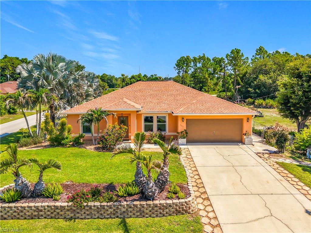 Unique Pool Home on Over Half an Acre with Exceptional 1,200 Sq. Ft. Detached Building!

Welcome to 3522 4th Street SW in Lehigh Acres, where versatility meets opportunity. Situated on approximately .53 acres with paved road frontage on three sides, this well-maintained property offers a rare combination of comfortable living space, extensive updates, and a substantial detached concrete block building.

The home features 4 bedrooms, 2 bathrooms, and approximately 1,767 square feet of living area with an open-concept floor plan and tile flooring throughout. The former interior laundry room has been thoughtfully converted into a spacious walk-in pantry, while the laundry area has been relocated to the garage for added storage and functionality.

Recent improvements provide peace of mind, including a new roof (2024), impact windows (2024), and a new saltwater system (2025) for the heated pool. The screened pool and lanai, added in 2015, create an inviting outdoor living space ideal for relaxing or entertaining year-round.

One of the property's most remarkable features is the approximately 1,200-square-foot detached concrete block building, constructed in 2015. Complete with its own bathroom, water service, and 220-volt electrical service, this flexible space is currently utilized as a garage but offers countless possibilities for future use. Whether you're looking for additional workspace, hobby space, storage, a private retreat, or other permitted uses, this building provides exceptional flexibility.

The outdoor setting is equally impressive, featuring mature landscaping with palms, established trees providing natural privacy along the roads, fruit trees, and a dedicated garden area that creates a peaceful Florida setting.

Properties offering this combination of acreage, a heated pool, extensive updates, and a versatile detached building are rarely available. Schedule your private showing today and discover the many possibilities this one-of-a-kind property has to offer.