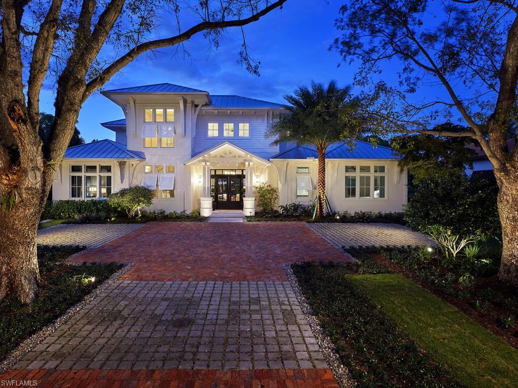 Live on one of the most desirable streets in all of Old Naples where a canopy of lush trees frames views of beautiful sunsets over the Gulf of Mexico – just a block from the beach and within a short distance from the city’s downtown. The Claremont built by London Bay Homes offers a private study that can be converted into an additional bedroom, and a luxurious master suite with two walk-in closets and its own private entrance to the zero-edge custom pool and spa. Stacking accordion glass doors open the great room and dining room to outdoor gathering areas, which includes an outdoor living and dining room with a fireplace and an adjoining alfresco dining space with an outdoor kitchen. Guests enjoy a private cabana with its own lookout balcony and wet bar above the three-car garage. The second floor offers a bonus room with covered balcony overlooking the pool and spa, wet bar, and two guest suites. Interior design, furnishings and selections completed by the award-winning Romanza Interior Design.