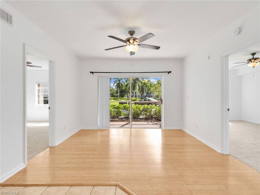 MUST SEE! This freshly painted, first-floor 2-bedroom 2-bathroom END UNIT condo in the desirable & conveniently located community of Gardens of Bonita Springs offers an open-concept great room split bedroom floor plan. Flooring includes bamboo in the main living areas, brand-new carpet in the bedrooms (June 2026), and tile in the bathrooms and laundry. The bright kitchen offers classic white cabinetry and stainless-steel appliances, including a BRAND NEW LG French door refrigerator and BRAND NEW LG range (June 2026), alongside an updated Whirlpool dishwasher (2021), tiled backsplash, and a pantry. Perfect for everyday living, the primary suite showcases a large walk-in closet and an ensuite bathroom equipped with a combo tub and tiled shower, while the guest bedroom includes a newly installed ceiling fan and window blinds are found throughout the home. A dedicated in-residence laundry room complete with built-in cabinets houses new Whirlpool washer and dryer updated in 2025 and wire hanging shelf. The water heater was also recently updated in 2019. CONVENIENT & COMPLETE HURRICANE PROTECTION features an electric shutter on the screened in lanai & accordion shutters on all windows providing peace of mind and ease. Exceptionally pet-friendly, this condo welcomes up to 2 pets with a generous 70-pound weight limit and includes one assigned parking space located just steps from your front door. Residents will enjoy a short walk across the street to the fantastic community amenities—including a resort-style pool, fitness center, picnic area with grills, playground, community room, kitchenette & library—all supported by a LOW HOA of just $299 per month that covers exterior insurance, landscaping and reserves! Flexible rentabilty allowing 12 rentals per year with a 30 day minimum (check availability). Conveniently located a short drive to I75, downtown Bonita Springs featuring Sugar Shack, Riverside Park and tons of restaurants and activities! Bonita Beach, Barefoot Beach & Lovers Key State Park are just 15-20 minutes away. LOOKING FOR CONVENIENCE AT A GREAT VALUE? DO NOT MISS THIS OPPORTUNITY!
