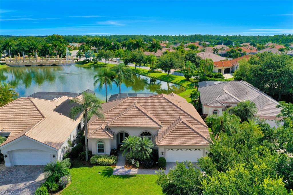 Welcome to Oak Colony, a private enclave of 18 homes in the Vineyards. This meticulously maintained 3 bedroom 3 bath pool home, with a gorgeous lake view, welcomes you. Across from the front of the home is a private, tree-filled park with benches and walking path. The open and inviting floor plan is filled with natural light. The kitchen features beautiful white cabinets with granite countertops, built in desk and volume ceilings. New GE Profile stove and microwave being installed! Enjoy beautiful hardwood flooring in the living, dining and kitchen areas. The spacious master suite includes walk-in closets and an inviting master bath with a separate jetted tub, shower and his/her vanities. You’ll love the utility room storage space and sink! Enjoy the beautiful Florida weather on your screened in patio complete with your own pool and hot tub! The Vineyards offers an on-site shopping center, dining, medical, 2 championship golf courses, tennis courts, fitness center, 32 acre park and so much more.
