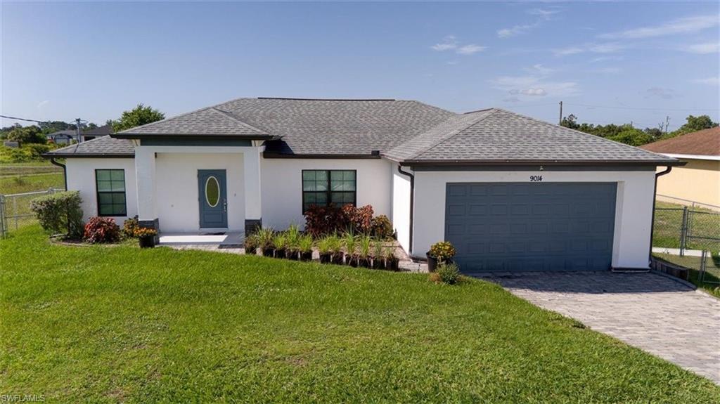 Built in 2021, this well-maintained concrete block home offers 3 bedrooms, 2 bathrooms, and a desirable split-bedroom floor plan. The open-concept living area is perfect for everyday living and entertaining, while the kitchen features granite countertops and ample cabinet space. Tile flooring runs throughout the home, providing a clean, modern look with easy maintenance. The fully fenced backyard offers plenty of space for children, pets, or weekend gatherings and includes a play set. Paver accents on the driveway and front walkway add to the home's curb appeal. Conveniently located, this home combines modern construction with a location close to schools, shopping, dining, and local amenities.