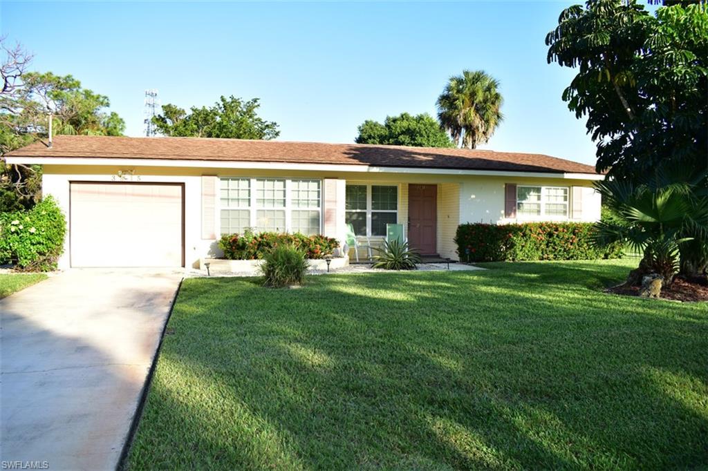 This home was updated with no expense spared! A gorgeous kitchen with high end cabinetry and granite counter-tops, compliments the beautiful tile throughout the living space. With an empty lot next to this home, it makes for a quiet and peaceful place to live. BRAND NEW POOL!!! The updates even include impact glass windows, jetted bathtub and much more! A large heated saltwater pool in the screened-in yard is a perfect place to enjoy the wonderful Florida weather. Come see this home and you will not be disappointed! Owner Financing available.