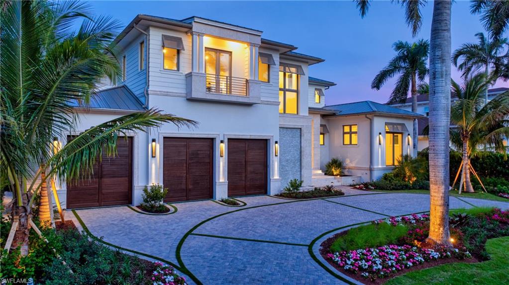 An extraordinary opportunity in the heart of Aqualane Shores, CONSTRUCTION, FURNISHINGS AND CERTIFICATE OF OCCUPANCY COMPLETED JANUARY 2026. This waterfront estate commands one of the area's most coveted settings. Gracious entry set on a rare, oversized lot with 100 feet of frontage at both the street and water, the property enjoys sweeping water views and direct, no bridge access to the Gulf. On a quiet street just steps from Naples pristine beaches and celebrated dining and boutiques of Third Stre026et South, the location is nothing short of exceptional. Designed by renowned architect Jon Kukk and masterfully crafted by D. Garrett Construction. This 6,457 square foot residence embodies refined coastal elegance with seamless indoor-outdoor living. A gracious entry opens to expansive interiors that flow effortlessly to a stunning waterside Lanai, where a rare cut -in boat slip creates an intimate connection to the water-transforming the outdoors into an extension of the living space. Eastern exposure bathes the lanai and patio area in mourning, midday light while providing shade in late afternoon and evening.Built-in electric storm shutters/screens for the lanai and patio area. Additional features include Rufino Cabinetry, HVAC Fresh Air Intake, Humidifier and De-Humidifier, Micro-tile Duct Board for Rigid Air Ducts, Whole House Make Up Air, Kitchen Hood Make Up Air. Wolf 48" Dual Fuel Range, Sub-Zero Refrigerator/Freezer, Sub-Zero 24" Wine Storage, Cove and Miele Dishwashers, Wolf Wall Oven, Wolf Coffee System, European White Oak flooring, Zip System Roof, Gulflok Standing Seam Metal Roof with PVDF Paint Finish. Coffee bar in owners suite with refrigerated drawer’s . Nanny's apartment with separate exterior entrance, kitchen area with full size refrigerator, microwave and sink. Boater enthusiasts will appreciate the exceptional waterfront amenities: Rare 17.4ft x 30ft Cut in Boat Slip plus a New 52 foot long Dock with a fish cleaning station along a new Seawalll accommodating an additional vessel. Outdoor shower completes the coastal life style. Car collectors take note: the True three-stall,  Air condition Garage with the ceiling height suitable for vehicle lifts , offering potential parking for up to six cars. Elevator services the garage and both living levels of the home. Home has a 10 foot 1 inch elevation. Custom design, finish in this home represents a uniquely high-level design, construction, finish, interior design and furnishings.