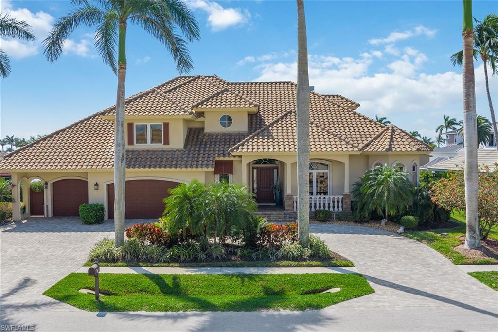 Craving an idyllic lifestyle in picturesque Marco Island? Look no further than this immaculate 3-bedroom plus study, 4.5-bath home that offers SW exposure, very quick direct access to the river and Gulf and is sure to impress with its upgrades throughout! A stunning 3,569-sq ft interior greets you with diagonal tile floors, crown molding, plantation shutters, impact windows and solid 8-ft doors. KitchenAid stainless appliances, wood beam ceiling and designer soft-close cabinets await in your culinary haven. French doors reveal a handsome den with built-in cabinets and wood plank floors. The master bedroom is highlighted by a tray ceiling, walk-in closet and lanai access. Its chic en suite has granite-topped cabinets, jetted tub and walk-in shower. Motorized shades add comfort as you admire sunsets from the southwest-facing screened-in lanai. Host cookouts with built-in BBQ or enjoy a dip in the heated pool. A highlight of this home, your newer private dock with a 27-ft boat lift and Jet Ski/kayak lift for easy boating. Other features include a large open loft with kitchenette, 224-sq ft storage/mech room, electric shutters, a whole-house generator, security and a 3-car garage.