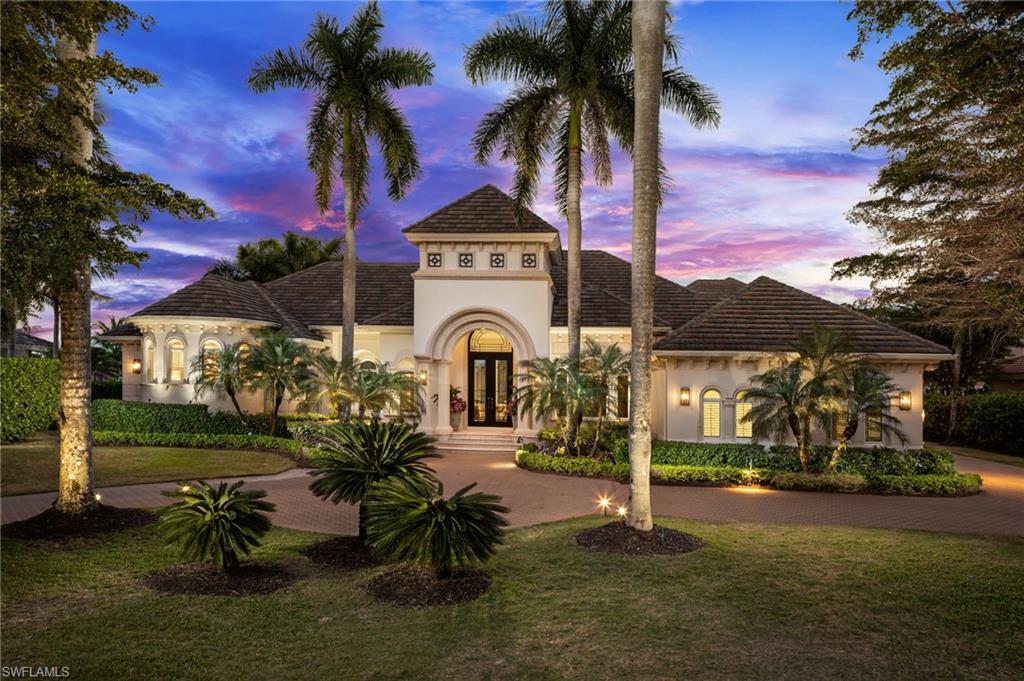 Move-in ready and extensively renovated, 2145 Canna Way will simply captivate you. Perfectly positioned on one of Grey Oaks’ most prestigious streets, it offers sweeping water, fairway, and sunrise views. Classic architecture has been artfully reimagined with a striking modern interior, creating 6,074 square feet under air and 8,102 square feet total of luxury living space filled with abundant natural light and soaring ceilings. At the heart of the home is an extraordinary, state-of-the-art kitchen featuring dual islands with leathered quartz countertops, a curated suite of Wolf and Miele appliances—including double gourmet ovens, steam oven, warming drawer, built-in coffee system—two dishwashers, double beverage drawers, and a spacious hidden walk-in pantry. Gracious entertaining spaces unfold in an open living and family room design adjoining the kitchen, highlighted by a bespoke wet bar concealed behind custom art-glass panels—true works of art—enhanced by discreet wine coolers and an integrated ice maker. The large and luxurious primary suite is a private retreat with his-and-hers custom walk-in closets and dual water closets, including a smart heated bidet and heated towel rack. Three beautifully appointed guest suites include two king-sized retreats and a versatile third suite, currently styled as a second office with a pull-out guest sofa. All offer en-suite baths and generous walk-in closets, with three bedrooms enjoying serene water views. Additional highlights include a richly paneled, oversized study—also with water views—and a flexible second-floor loft ideal for a guest getaway or grandchildren’s flex space. Outdoor living is exceptional. Flanking the pool is a grand covered family room with fireplace, television, outdoor kitchen, and motorized shutters and screens, creating an inviting setting for year-round entertaining against a breathtaking backdrop. The comprehensive renovation included new wiring, plumbing, HVAC systems, roof, garage doors, and a complete redesign and rebuild of the front façade, along with the addition of Control4 lighting and whole-home automation. An oversized three-car garage with custom cabinetry completes the offering. This wonderfully private residence is located within the gates of the incomparable Grey Oaks Country Club, offering unrivaled amenities including three championship golf courses, two clubhouses, a resort-style pool, tennis and pickleball facilities, multiple dining venues, and a 30,000-square-foot Wellness Center and Spa.
