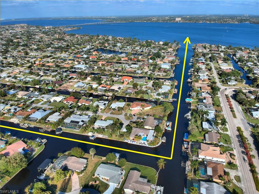 Impeccable Direct Access Home with No Bridges and literally minutes to the open water! 3 bedroom +den/office with 2 tastefully remodeled baths. One of the bedrooms is being used as a fun entertainment room with impact French doors that open to an additional outside seating area that overlooks the water. Metal roof, brand new AC, impact windows, newly painted interior and exterior, AMAZING KITCHEN with one of the biggest granite islands I have seen, great for entertaining, solid high-end wood cabinetry with decorative inlay glass fronts, new appliances, huge sub-zero refrigerator, beautiful copper farmers sink, lighted built-ins, separate coffee/wine bar with wine cooler fridge. Just off the kitchen is the Florida room with double French doors that lead out to the huge covered outdoor living space. The dock has a slate seating area, composite decking and 10k lb boat lift-2 new motors, and new wiring and lighting.
Assessments in & paid, Perfect location with easy access to the beaches, restaurants and shopping, close to SWFL International airport, This wonderful home has been lovingly remodeled and cared for with attention to every detail. Come relax and enjoy the Florida lifestyle.