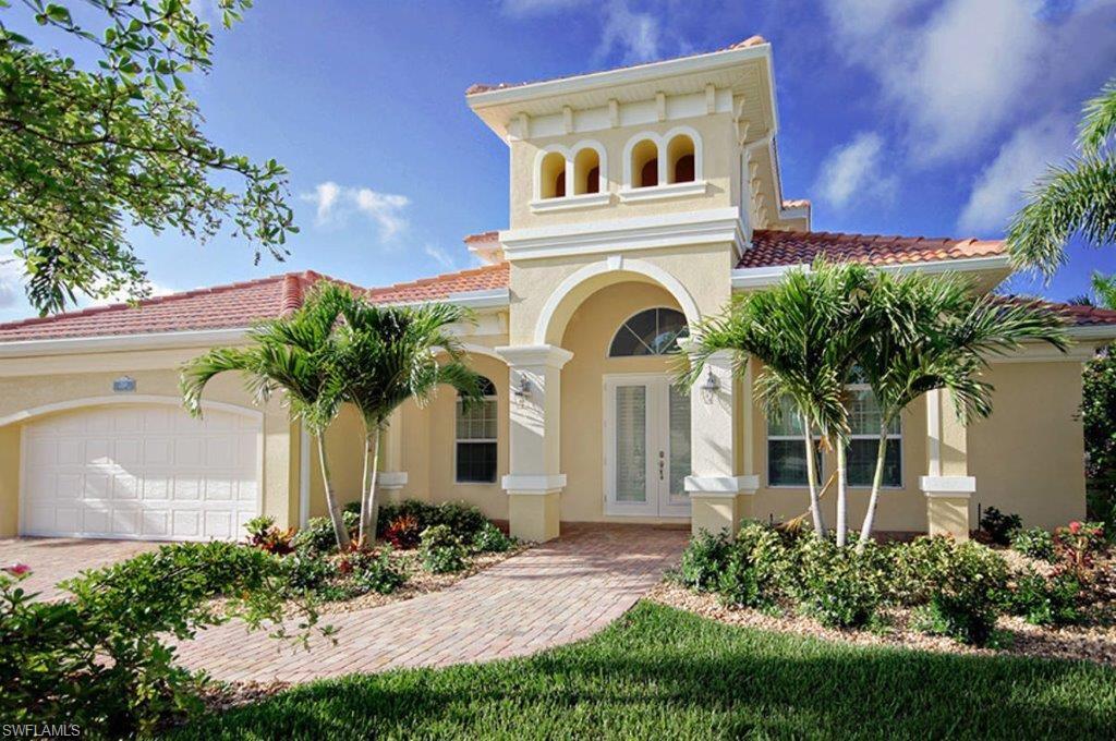 Southern Exposure Gulf Access Home in Cape Harbour. Villa Tropicana you luxurious waterfront living in one of the most desirable locations in Cape Coral. Surrounded by a lush garden, this turnkey property offers 4 bedrooms & 4 bathrooms, an attached 3-car garage as well as a composite captain’s walk and boat lift. The home is custom-built on a oversized lot featuring southern exposure to the idyllic canal. Take in amazing sunsets from the upstairs balcony overlooking the waterway to the Gulf. Attention to detail is felt throughout this tastefully designed residence. Countless upgrades include impact proof windows, granite counter tops, tile and wood floors, contemporary furniture from a German manufacturer and 3 A/C units. Entertaining will be a breeze in the generous, screened outdoor area featuring a built-in summer kitchen, dining & lounge area, as well as a 40 ft. long infinity edge pool & spa with saltwater system.Part of the prestigious Cape Harbour Community, the estate offers you an array of lifestyle benefits including well-known restaurants & shops overlooking the marina, and the opportunity to play tennis or use the gym. Call to schedule your private tour today.