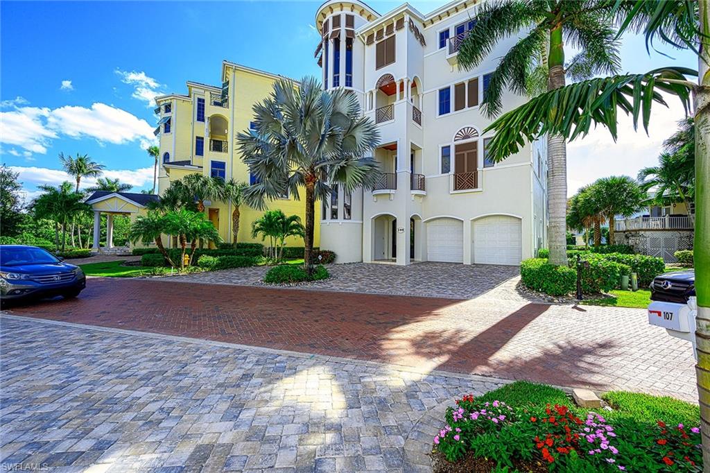 Only the finest amenities & features can be found in this home, including solid concrete construction, hurricane impact windows & doors, electric shutters & screens, voluminous ceiling heights w/dramatic details & private elevator to all floors. The main level features great room w/fireplace and pocketing sliders to allow for panoramic Gulf views. Web bar with ice maker/refrigerator/wine refrigerator and guest bath. The lanai is perfect for entertaining & features an outdoor kitchen, including built-in gas grill. The gourmet kitchen features the highest quality appliances, including gas range w/double ovens, warming drawer, pot filler & built-in cappuccino maker. The 3rd floor includes 3 private guest suites w/full baths, double vanities & private lanais and wet bar w/ice maker/refrigerator.  The 4th floor features a den/home office w/beautiful driftwood flooring & custom built-ins. The master suite includes private lanai w/spa overlooking the ocean & sitting area w/touch panel fireplace surrounded by marble. The spacious master bath offers a soaking tub, large walk-in shower, stunning etched glass & views of the Gulf.  There are two laundry rooms each on the 3rd and 4th floors.