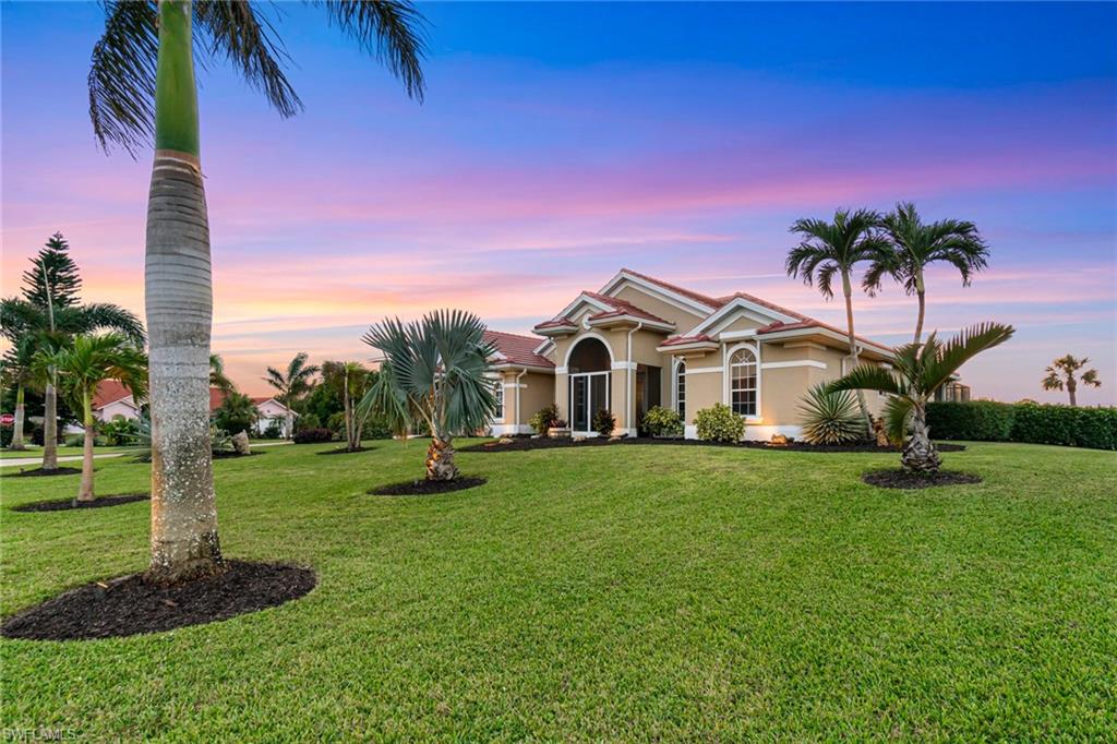 Looking for close to everything and still a feeling of remoteness? This spacious and bright home is just that. Situated on a 1-acre, immaculately manicured corner lot, you are perfectly removed from hustle and bustle. Besides the well-thought out floor plan and 2.5-car garage, you will appreciate the touches and features of this elegantly, modern design. In addition to a salt-water heated pool and pocket slider on the lanai, this home boasts extensive landscaping with lighting, quartz countertops, stainless steel appliances (approximately 4 years old), crown moulding on the kitchen cabinets, redone bathrooms, a built-in surround sound system, new water heater, newer pool pump, pool heater and AC, electric shutters, in-wall extermination system, French drains for the pool deck and a NEW ROOF as of September 2024. And did we mention this home also has a western exposure for the perfect end to your day? Make sure you check out the sunset pictures! Located just behind the community of Bonita Terra, Bell Villa home owners can enjoy their amenities which include 2 pools, pickleball, driving range, restaurant, tennis, bocce, baseball, clubhouse, shuffleboard, fitness room and more for a nominal, additional annual fee of $400 per household. And, for an additional fee, there is storage available (space permitting) for your boat. If you want to be close to everyday conveniences AND feel like you have your private little oasis, this home is the perfect year-round retreat. This is a must see so bring your buyers and all offers.