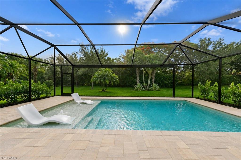 One or more photo(s) has been virtually staged, AI generated or rendered.  Immaculate and move-in ready with a new pool! The Preserve at Corkscrew is located in preferred zone X outside
of the flood zone for extra peace of mind. This lovely home has full hurricane protection, including electric shutters on the lanai, hurricane glass/windows on the front of the house, and accordion hurricane shutters on the sides- nothing to worry about here! The spacious and private backyard offers a sparkling pool with sun shelf and picture window screen enclosure. This IMMACULATE home was built in 2013 and looks like a model. Built by Pulte builders, the popular Vernon Hill II floor plan offers a large open great room, three bedrooms, a den, 2 bathrooms, and a finished two-car garage with an additional four feet extension and epoxy flooring for durability. Step inside to discover large diagonal tile flooring and a freshly painted interior. The gourmet kitchen showcases upgraded granite countertops, a stylish tile backsplash, stainless steel appliances, rubbed bronze faucets, soft-close drawers, and plenty of storage with rich cabinetry expanding into the bright eat-in area. The great room is ideal for entertaining, with a surround sound system and a formal dining area. Crown molding enhances the elegance of all major living spaces. Retreat to the spacious primary bedroom, with dual vanities, a relaxing bathtub, and a frameless glass shower equipped with handheld and rain shower heads. The Preserve at Corkscrew is an incredible nature-filled gated community with dedicated nature preserves, numerous lakes, street lights, and sidewalks. There is an active social committee with ongoing activities, and of course, PICKLEBALL is HUGE. You can even learn the sport on
certain nights. The location is just minutes from I-75, world-renowned shopping & dining, beautiful beaches, award-winning golf, Hertz Arena, Naples, FGCU, & RSW Airport. Low HOA fees include all lawn maintenance with resort-style amenities, including a fully equipped gym, yoga/flex room, tot lot, tennis/pickleball courts, a resort-style pool with cabanas, palm trees, and a deck overlooking the lake.