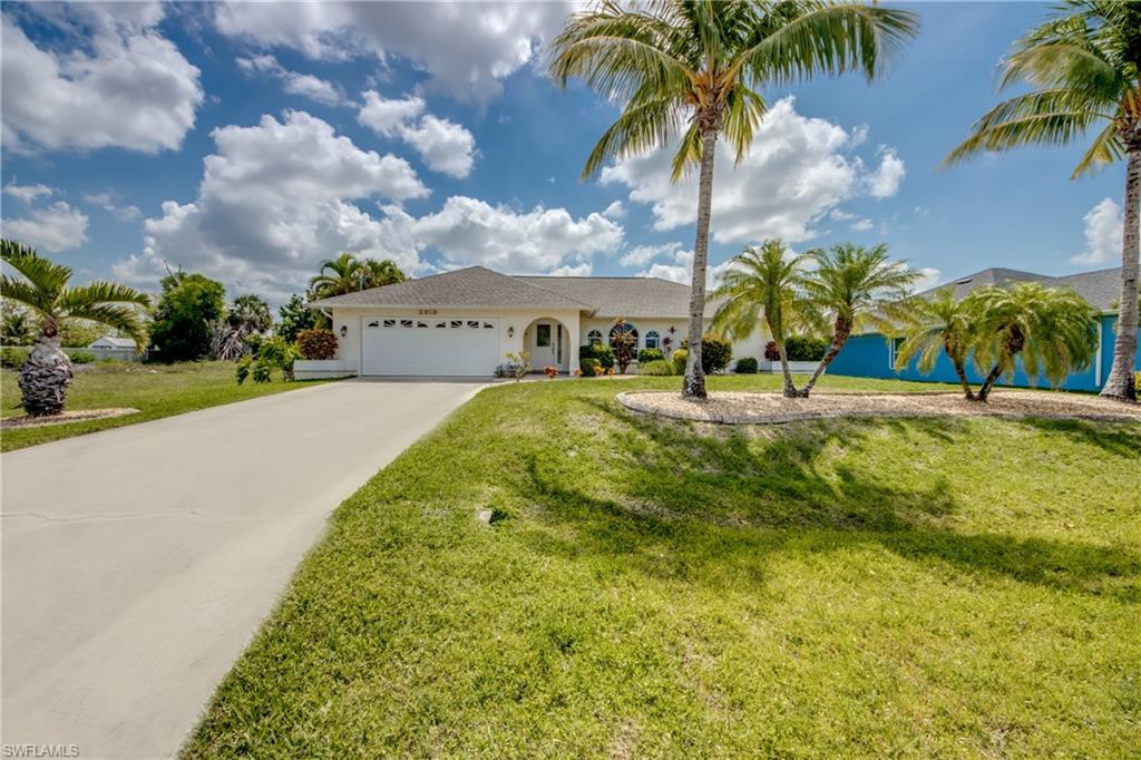 Welcome to your private oasis in SW Cape Coral! This beautifully maintained 3-bedroom, 2-bath pool home sits on an eastern-exposure lot in a quiet residential neighborhood, offering sunny mornings and shaded afternoons on the lanai. Step inside to an inviting open floor plan with tile throughout and plenty of natural light. The living and dining areas flow effortlessly to the screened, paved pool deck through wide sliding doors—perfect for everyday living and easy entertaining. The spacious primary suite features its own sliders to the pool area, a walk-in closet, and an updated bathroom. Both bathrooms have been remodeled and modernized, giving the home a clean, move-in-ready feel. The kitchen is fully equipped with stainless steel appliances, granite countertops, and ample cabinet and counter space so you can cook and host with ease. Outside, enjoy a newer pool (2010), new roof (2022), new AC (2020), and a fully fenced backyard that provides privacy and room for pets, gardening, or play. Whether you’re looking for a full-time residence, seasonal retreat, or investment property, this well-cared-for home delivers the SW Cape lifestyle—close to everything yet tucked away on a peaceful street. The house comes turnkey so it's move-in ready. Come see why living in SW Cape Coral is so easy to love!
