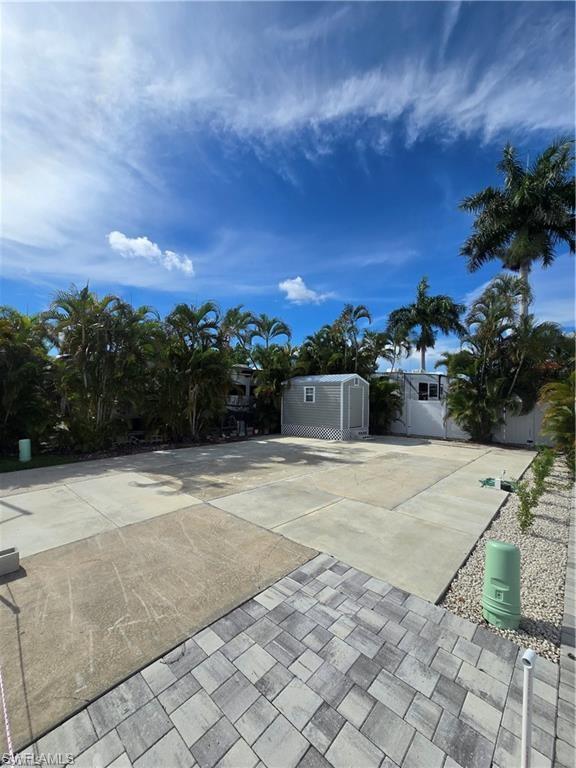 Prime location in an active 55+ gated community with direct Gulf access! This well-maintained property is ideally situated just steps from the community's outstanding amenities and offers a move-in-ready opportunity with major improvements already completed. Recent upgrades include a new power post and meter (2023), concrete work (2024), and a new 8' x 12' shed with underpinning (2025). The lot measures approximately 2,520 square feet, offering ample space for your RV or manufactured home. Conveniently located just 200 feet from the clubhouse, 300 feet from the bathhouse and laundry facilities, and approximately 450 feet from the office, recreation hall, mailroom, shuffleboard courts, and bocce ball courts, you'll enjoy easy access to everything this vibrant community has to offer. Residents enjoy a boat ramp with direct Gulf access, an active social calendar featuring water aerobics, chair aerobics, bingo, poker, bowling, shuffleboard, bocce leagues, and numerous community events throughout the year. A storage lot is also available by waitlist, and residency requires a background check. The location is hard to beat, with Publix, CVS, restaurants, fitness centers, and other everyday conveniences right next door. Southwest Florida International Airport is approximately 15 minutes away, while Fort Myers Beach is just 20 minutes from the community. Affordable ownership includes low annual property taxes of approximately $625 and HOA fees of $620 per quarter. Whether you're looking for a seasonal retreat or a year-round residence, this property offers an exceptional combination of affordability, convenience, amenities, and the Florida lifestyle you've been searching for. Bring your RV or manufactured home and start enjoying everything Southwest Florida has to offer.