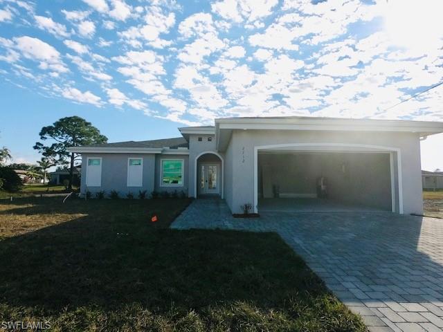 Prime Location!!! **Complete by the end of March 2021** Welcome to NW of Cape Coral, one of the fastest growing areas in the beautiful city of Cape Coral !! This wonderful modern open floor plan concept brand new  Single Family Home "Paradise model" features nearly  1,700 Sq. Ft of living space, 3  bedroom plus den,  2 Full  new bathrooms with Quartz, 2 car garage . Freshly painted inside and out, epoxy in garage, new kitchen with soft-close cabinets, Quartz counter tops, island, new stainless steel appliances, new doors, new based boards,  new  AC system, new light fixtures, new plumbing, new smoke detectors, alarm system new water heater, new well equipment. Home is equipped with Taex built-in pest control system, irrigation system,  hurricane impact doors and windows, laundry room,  Spacious master bedroom, new master bath, double-sink, 1 huge walk-in closet, new plank tile throughout the home. The location is close to many of Cape Coral top schools, closer to US 41, North Fort Myers, hospitals,  shopping, dining, entertainment & less than 40 mins to SW Florida International Airport, NO HOA Fees. This home will not last! Photos are renderings of the home.