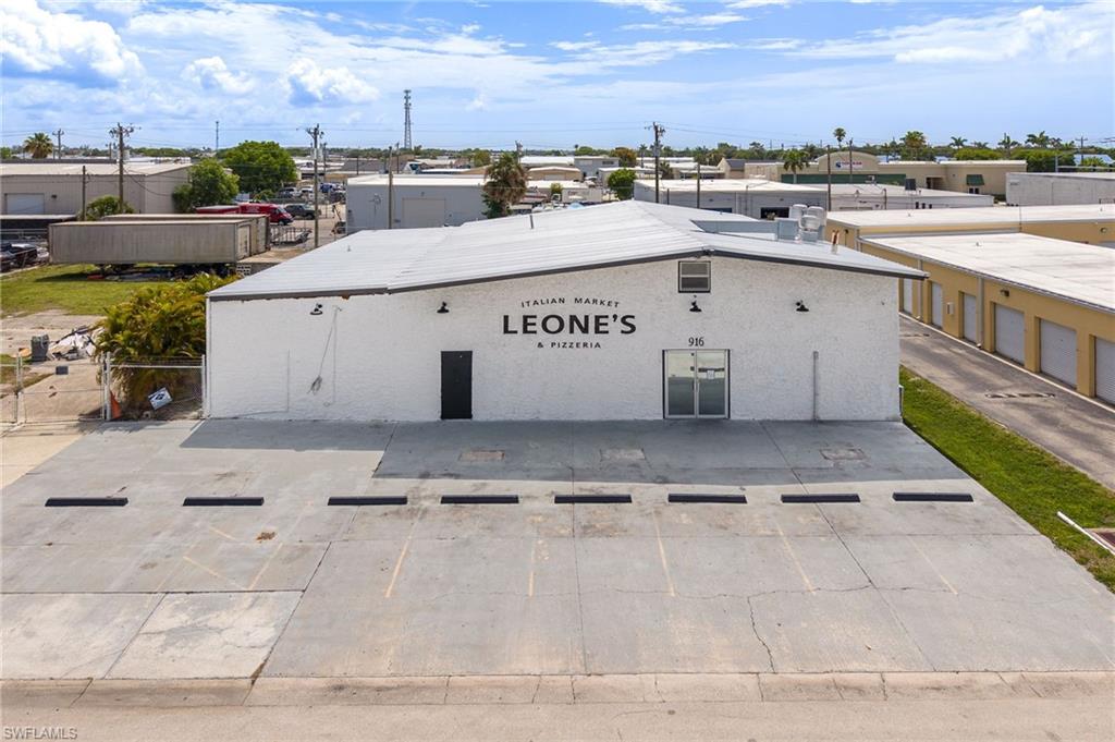 Exceptional investment opportunity in Cape Coral's heavy industrial zoning district. The under air SF is just under 5,000 SF on .52 acres and the yard is fully fenced. Home to the well-known Leone's restaurant, this property offers a rare combination of established restaurant use and highly sought-after industrial location. Whether continuing the existing restaurant operation, repositioning the property for an owner-user, or revert back to an industrial use, the possibilities are significant. Properties within this district are increasingly difficult to acquire, making this a unique chance to secure a strategic asset in one of Cape Coral's most valuable commercial and industrial corridors.