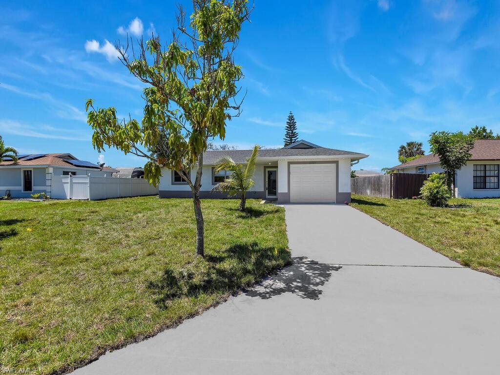 Back on the market. Buyer was unable to perform. Appraisal came in at $515,000 !! Exceptional upgrades throughout this amazing home! Just like a new home. Well over one hundred thousand dollars in major improvements to this home. Everything was done with a permit --> New Roof, new kitchen cabinets, backsplash and countertops, new appliances, new A/C system and new ductwork, new electric entire home with new panel, new insulation, new lighting, new bathrooms with new tile and cabinets, new floor tile, new trim, new interior doors, new lighting outside, new stucco, new paint, new patio with tile, new impact front door, new impact garage door, new garage epoxy, new water system, new sprinkler system with timer, new drain field, new well, new sod and much more to list. Huge backyard with fence on 3 sides - easy to fence off completely on sides of home. This home has it all!