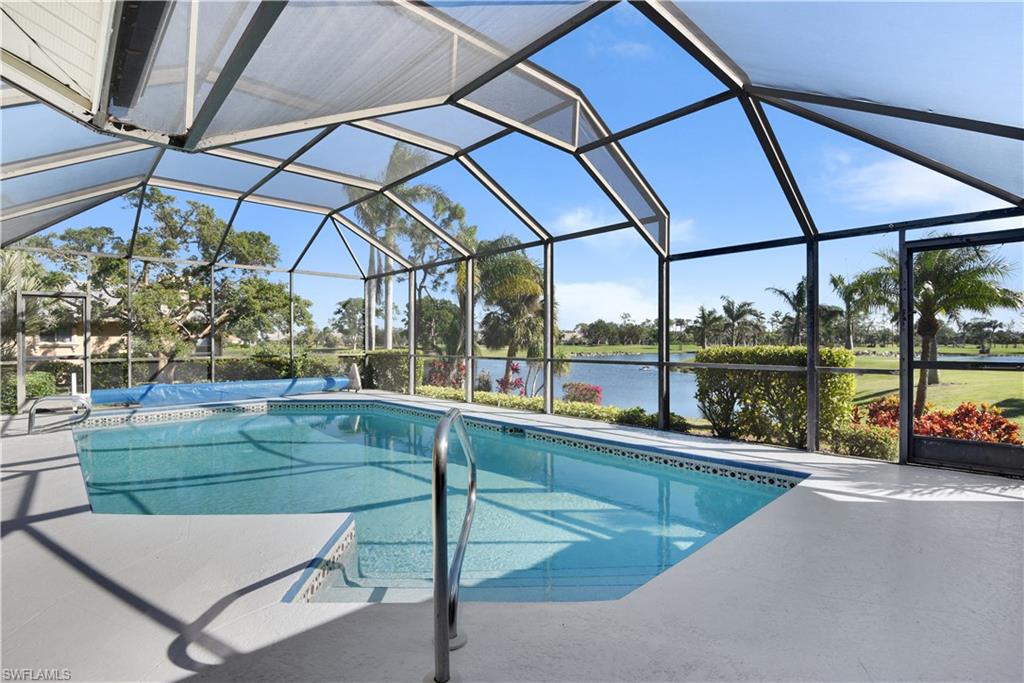 Custom built pool home with gorgeous golf course and lake view! This home is one of the few Estate Homes in The Forest and is being sold by the original owners who have meticulously maintained the property. Situated on a low traffic & quiet cul-de-sac, offering almost 2,600sf of living space with a gourmet designed kitchen that includes wood flooring, a wet bar, cabinet pull outs and soft closing drawers, stainless steel appliances, long breakfast bar w/ lots of storage, a large service window to the kitchen area on lanai, and a breakfast nook that has two sets of sliders giving you an amazing view! Cathedral ceilings and large panel sliders create a wonderful open feel, plus it features a fireplace, elegant glass French door entry, huge master suite, central vac system, and garage storage. The spacious pool lanai overlooks the 10th hole surrounded by water and is perfect for entertaining or enjoying the beautiful sunrise. The pool pump motor is brand new on the heated pool & spa, slip resistant epoxy on pool deck, a kitchen/service nook, pool bath and storage closet. Nothing can be built on the reserve behind the home. Membership to two championship Golf courses is optional.
