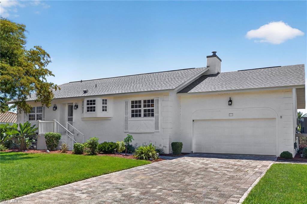 This near beach beautifully renovated elevated pool home has gorgeous western views over the pool and lake. The den easily functions as a third bedroom with direct access to the deck and pool area. New roof and interior renovation in 2023. White shaker style cabinets, quartz counters and stainless steel appliances. French doors line the living room, connecting it to the spacious covered porch. With a large pool and tropical landscaping, the waterfront backyard is ideal for enjoying sunny days and evening sunsets. Beach access is nearby, making this your perfect new beach house!