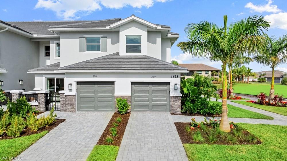 What's Special: Lake View | Premium Location | Dedicated Study | Oversized Garage | 3 Full Baths. New Construction - December Completion! Built by America's Most Trusted Home Builder. Welcome to the Romano at 15345 Giardino Drive Unit 204 in Esplanade by the Islands Coach Homes! This beautifully designed home offers an open-concept layout centered around a spacious great room, where a fireplace creates a warm and inviting place to relax or entertain. The kitchen is equally impressive with upgraded appliances, quartz countertops, ample cabinet space, and a large island that keeps everyone connected. Tucked away for privacy, the primary suite features a spacious bath with a large walk-in shower, creating the perfect retreat at the end of the day. Two secondary bedrooms, two full baths, and a dedicated study provide flexibility for guests, hobbies, or working from home, while the lanai extends your living space outdoors. Additional Highlights Include: laundry room sink, crown molding, shower in place of tub in the secondary bath, and all appliances included. Photos are for representative purposes only. MLS#226025379 - Esplanade by the Islands Coach Homes offers an unparalleled lifestyle with resort-style amenities and wellness programs to inspire and invigorate. Whether you’re seeking active adventures or peaceful retreats, this community delivers luxury and sophistication at every turn. Swim laps or lounge by the resort-style pool, sip a refreshing drink at the Bahama Bar, or recharge at the state-of-the-art wellness center. Stay energized with tennis, pickleball, and bocce courts, or indulge in unique experiences like wine tastings, cooking classes, and live concerts. The culinary center provides both fine and casual dining, along with opportunities to hone your cooking skills. From relaxing spa events to exciting excursions, Esplanade by the Islands makes every day a celebration of vibrant, carefree living.