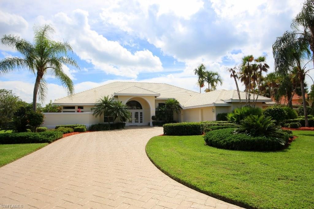 Light, airy, & bright Wildcat Run home in the heart of Estero!  Every opportunity to embrace the lakefront view has been captured via oversize windows & sliding doors in Master, Living Room, & Kitchen/Family Room areas.  Paver driveway with oversize arched covered entry.  Soaring ceilings with neutral decor.  Master Suite boasts morning kitchen complete with on-demand hot water, sink, & mini-fridge; walk-in & linen closets, additional built-in storage & entertainment cabinets, dual vanities with glass-enclosed shower, soaker tub under large picture windows with private courtyard beyond.  Open concept gathering area between kitchen & family room complete with island, wet bar, & fireplace make for an ideal entertainment area.  Split bedrooms offer plenty of privacy for owners & guests.  Freshly updated pool & spa will keep guests cool while you enjoy using the outdoor kitchen complete with built-in grill.  Minutes from 3 major shopping/dining areas, SWFL International Airport, Germain Arena, FGCU, & more.  Just a short drive to enjoy gorgeous beaches or historic downtown Fort Myers & Naples.  Golf equity membership available but not included in listing price.