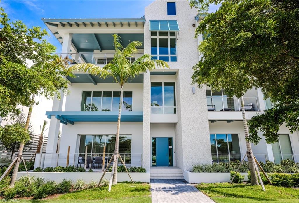 Welcome to The Mark on 8th, a premier luxury condominium development in downtown Naples. Ideally situated in the heart of Olde Naples, this residence is just steps away from the exceptional boutiques, cafes, restaurants, and pristine sandy beaches along the Gulf of Mexico. Residence 101 is an impressive two-story townhome offering 3,134 square feet of luxurious living space, featuring 3 bedrooms plus a den and 3.5 baths, along with a second-floor loft lounge. Expansive 9-foot sliding doors lead to multiple private outdoor areas, seamlessly blending indoor and outdoor living. The open floor plan is highlighted by a stunning 25-foot ceiling in the spacious living room, creating a dramatic atmosphere for entertaining and relaxation. The gourmet kitchen, designed with both style and functionality in mind, overlooks the living and dining areas and is equipped with top-of-the-line appliances and exquisite finishes. The grand primary suite includes a private balcony, dual walk-in closets, and a serene spa-like bath for ultimate comfort. Additional highlights of this residence include two private storage units, a private elevator, and entrances on both levels for added convenience. The Mark on 8th offers a wealth of exceptional amenities, including an on-site golf simulator, a second-floor pool and spa, a fitness center, a sauna, and convenient attached parking. Enjoy outdoor grilling and unwind by the poolside fire pit, making this property a true oasis in the heart of Naples.