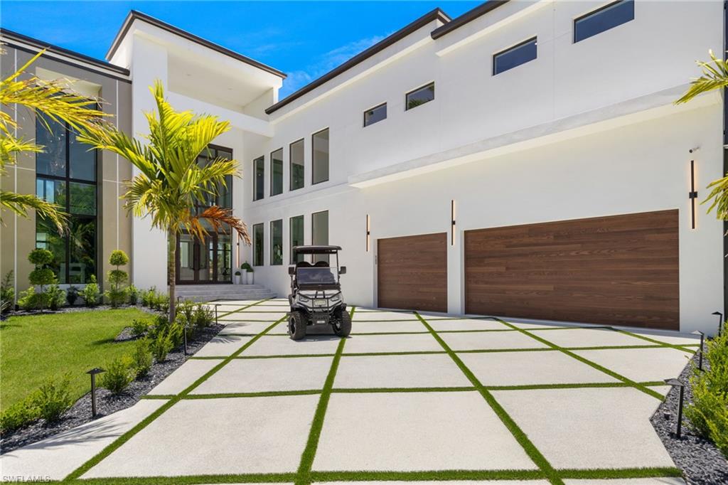 New Construction, intersecting canal, direct Gulf access property. 4 bed, 6 bath, family room, game room, office, additional butler kitchen. This Flagship project from Exclusive Designs features a contemporary design and an open floor plan. Impact-resistant windows and doors throughout bask the spacious living area in natural light. Two iPad stations on each floor provide full automatization of the house, pool, home lights, appliances, cameras, and environmental controls. The main kitchen is equipped with Cambria quartz countertops, Thermador appliances, custom all-wood cabinets, and automated cabinet openers. Additional buttler kitchen is fully equipped with LG smart appliances. The formal dining room includes a backlit costume wine display. Furthermore, powder room, game room and an office can be found on the ground floor. Upstairs consists of. Two second-floor master bedrooms boast walk-out terraces, walk-in closets, and bidet toilets. Additional two guest bedrooms with dedicated bathrooms and walk-in closets. The second floor culminates in a spacious family room. Outdoor Living, indoor and outdoor merge through 54 feet of the glass wall and access through 20 foot-wide sliding door. Lanai is finished in marble pavers with a sand finish. The summer kitchen consists of a Blaze 40" BBQ, a drinks cooler, and an ice maker. The pool and the jacuzzi are saltwater system equipped and heated. In addition, there is a pool bathroom and an outdoor shower for ease of entertainment. LP countersunk firepit at the side of the pool will provide a perfect evening at the end of the day. The property sits on a corner lot with 230 feet of seawall, just around the corner from the open water of Caloosahatchee River and the Gulf of America. Cape Coral downtown with its amenities is just 1.5 miles away and the beach is only half a mile from the house. All can be reached with a street-legal 6-person golf cart included with the house.