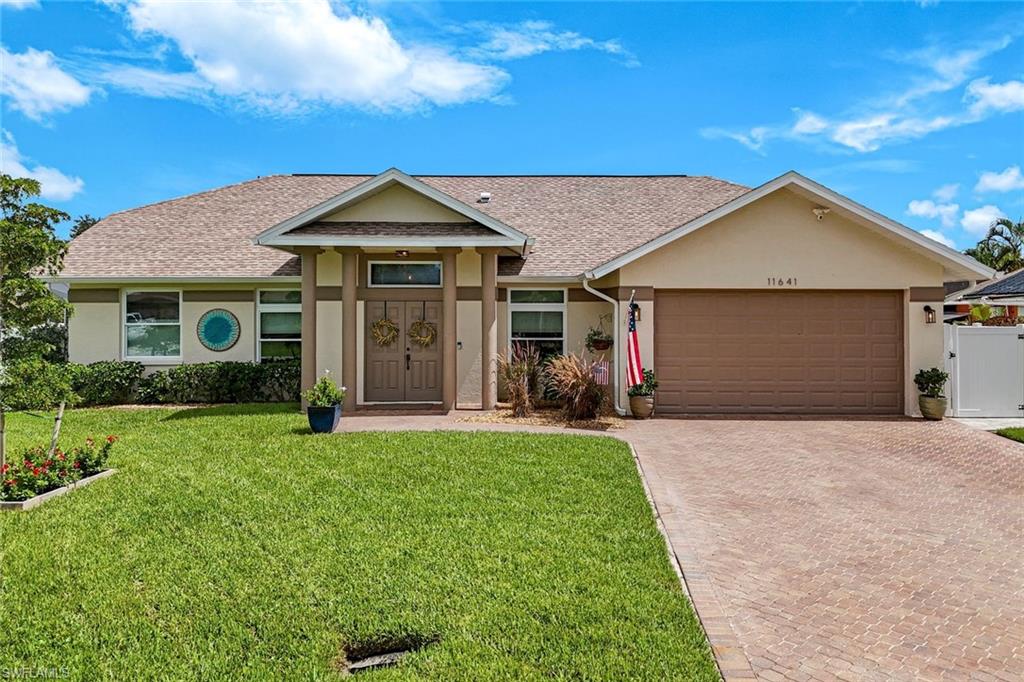 Welcome to this exquisite lakefront property in Bonita Springs, a true hidden gem within a non-gated community offering low HOA fees and unparalleled convenience. This beautifully renovated home boasts a stunning newly brick-paved pool lanai deck, a newly refinished saltwater pool, and a fenced-in side yard perfect for children and pets. Enjoy serene private landscaped views that seamlessly blend with the picturesque lake backdrop. Inside, the modernized kitchen features quartz countertops, a large breakfast bar, stainless steel Samsung appliance package, Pentair water filter, and a beautifully finished coffee/wine bar area. The property also offers the peace of mind of a newer roof, repiped plumbing throughout, new impact sliding glass doors and a newly epoxied garage floor. You'll enjoy a large master suite with updated bath including large walk in shower and updated vanity with quartz counter tops. All 3 additional bedrooms are spacious and functional. Updated full guest bath that also functions as your pool bath includes updated vanity, granite countertops, new lighting & fixtures and frameless shower door. Located just minutes from downtown Bonita Springs, you'll have quick access to a variety of shopping, dining, and outdoor activities, including the highly anticipated Mid-town Bonita, Coconut Point Mall, RSW, and stunning white sand beaches. This home exemplifies both tranquility and convenience in a sought-after location.
