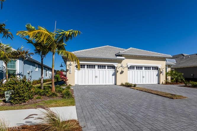 This absolutely stunning Villa in now available. This home has been furnished in a comfortable coastal decor with designer furnishings.  No need to wait for new construction, this villa is ready for you to begin enjoying the Florida lifestyle. You'll enjoy the private pool and spa while spending time in your screened Lanai overlooking the tranquil waters in your backyard. The lot has been landscaped with an abundant of new tropical plantings to provide additional privacy and beauty.  Some of the many features and upgrades include beautiful upgraded flooring, automated window shades,  quartz counters, tile backsplash, wine cooler, upgraded appliances and cabinetry. The Dahlia floor plan provides an open concept living, spacious and comfortable. The Isles of Collier is one of Naples' most sought after neighborhoods that is situated on over 2400 acres - with over half of that being natural preserves and lakes. Owners enjoy miles of walking and biking paths, restaurant, a beautiful resort style pool, lap pool, state of the art fitness center, pickleball, tennis, kayak and canoe launch along with other social amenities.