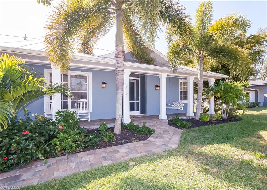 Priced BELOW Appraisal!! This is your time to relax in your own private oasis. Come and enjoy this spectacular tropical pool with cascading rock waterfalls. Enjoy morning coffee and evening swims in an idyllic, quiet setting. This Custom Built home has 3 bedrooms and 2 1/2 bathrooms with an over sized 4 car detached garage. Beautifully modeled and updated kitchen which opens to large family room and breakfast nook. The home has 2 new upgraded A/C units in the upgraded fully screened in Florida room and is recently painted. This attractively priced home represents an incredible value in Cape Coral. The home was recently appraised. At this price, enjoy a sound investment in a fabulous neighborhood.  Call today for a private showing of this remarkable home.