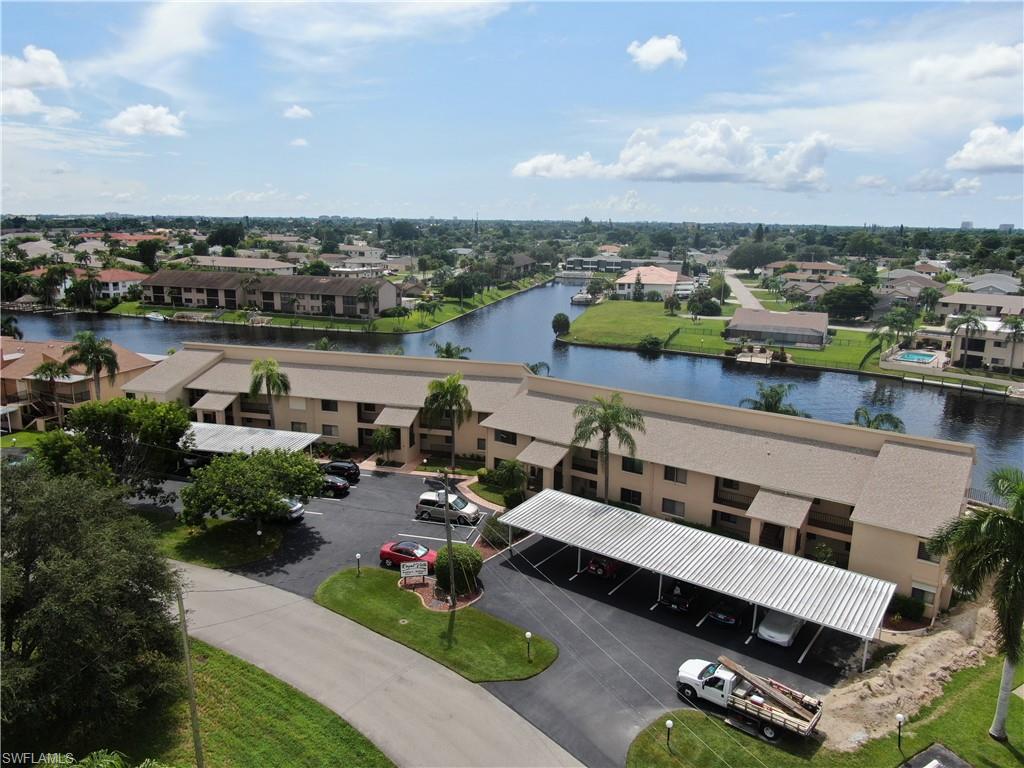 VERY RARE...GULF ACCESS TOWNHOUSE CONDO FOR SALE AT ROYAL VISTA. 55+ community. This spacious townhouse boasts over 1500 sq. ft. of living space with 3 bedrooms and 2.5 baths. Totally renovated with new wood vinyl plank flooring, new carpet, freshly painted, large open kitchen with wood cabinets and granite counters, new appliances, new updated baths with new cabinets and granite tops, new tiled shower in master. Large master suite with lots of closet space and a private 2nd story screened balcony overlooking the canal so you can enjoy beautiful sunsets! Formal living room and separate family room open to the kitchen. Florida room with outdoor kitchen/bar with new wood cabinets and granite top. Enjoy breathtaking view of wide canal...community boat dock with captain's walk. Walk right out of the unit to the pool area and waterway. Lots of storage in the unit plus private owners closet for extra storage. NEW AIR CONDITIONER AND ELECTRIC SHUTTERS.. Laundry in residence. Paradise awaits!!