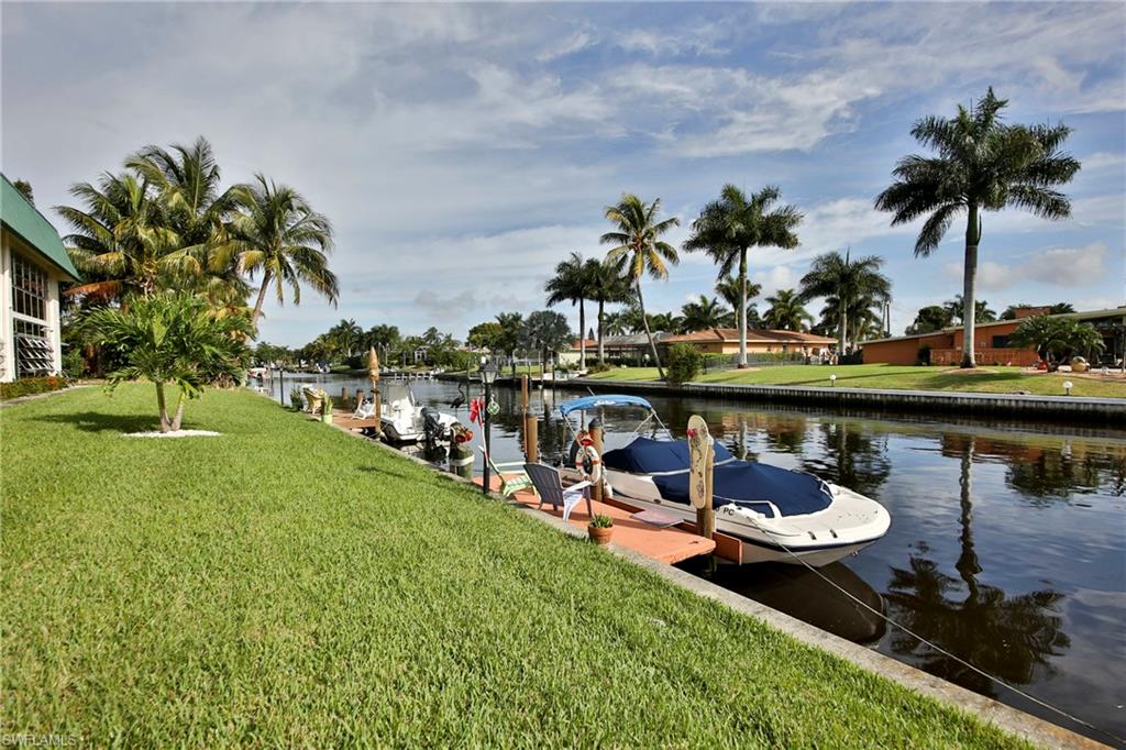Beautiful 2BR/2Bath Furnished Condo with Gulf Access is ready for you to move in!  Rare opportunity in this quaint 20 condo waterfront community. Enjoy the view of intersecting canals by the pool or from your 2nd Floor Lanai in this lovely 55+ community South Cape Coral condo.  Updated kitchen with quartz countertops, recessed lighting and updated floor tile.  New vanities in the bathrooms.  Walk-in closet and laundry in residence. You're in walking distance to grocery, restaurants, shops, and all that South Cape has to offer! Enjoy the heated pool, community rec room, and boat docks available on a first-come, first served basis too!  Nice!