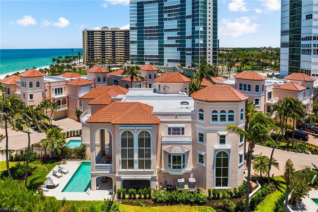This fabulous seaside villa, in the exclusive enclave of Casa Mar, offers a lifestyle like no other! A perfect beach retreat, it encompasses over 7,000 square feet total with its own private pool, fenced yard and direct access to Park Shore’s beautiful private beach. Offered by the original owners, it has been treasured for the fantastic outdoor spaces, magical year-round sunsets and 2-story wall of windows on the west and southwest. The kitchen was completely remodeled in 2022 and features top-of-the-line Thermador appliances, huge island, custom cabinetry and wood flooring. Wake up to the sound of the surf and Gulf views from the primary suite with a private balcony - a perfect way to greet the day. Hosting friends and family is a breeze with three spacious guest bedrooms, including a fun private loft area on the fourth floor - all with full baths. For the boater, Venetian Bay Yacht Club across the street offers docks for lease or purchase. Fabulous dining and world-class shopping are a short distance away at the Village on Venetian Bay. The HOA provides a full package of services including pool care, AC and elevator annual service and landscaping. Pets are welcome.