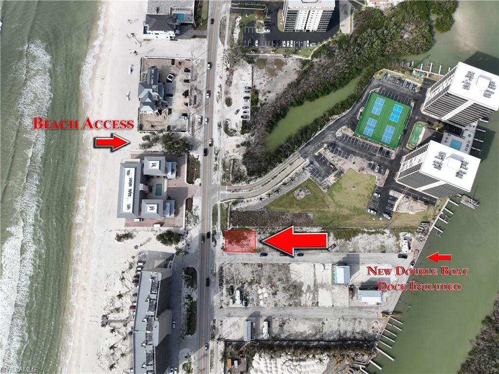 Rare opportunity to purchase a double lot in Bonita Beach Village that is the only property with direct west views of the Gulf of Mexico and has a double boat dock that will allow for a wider beam boat. Other features include: Beach access right across the street, premier boating with the pass to the Gulf just a few minutes away and the ability to boat to Ft Myers or to Naples with never having to go in the gulf, and all utilities are on the lot plus no large impact fees. The building can be two stories over the garage, and garage can be enclosed with garage doors or open pilings with storage. You can build a concrete custom home or order a high end two story modular which will be placed on top of pilings and tie beams. This property is the best priced option to live by the beach, with beach and sunset views, best of boating and low HOA fees. You can build an approximately 1900+ total square foot house per floor or 3800 sq feet total plus the garage area. There are three new homes completed and 4 more are permitted and construction will soon be underway. All boat docks are being replaced plus seawall. These reasonably priced lots are the best low cost option to build your new home and enjoy the ultimate in Florida lifestyle.