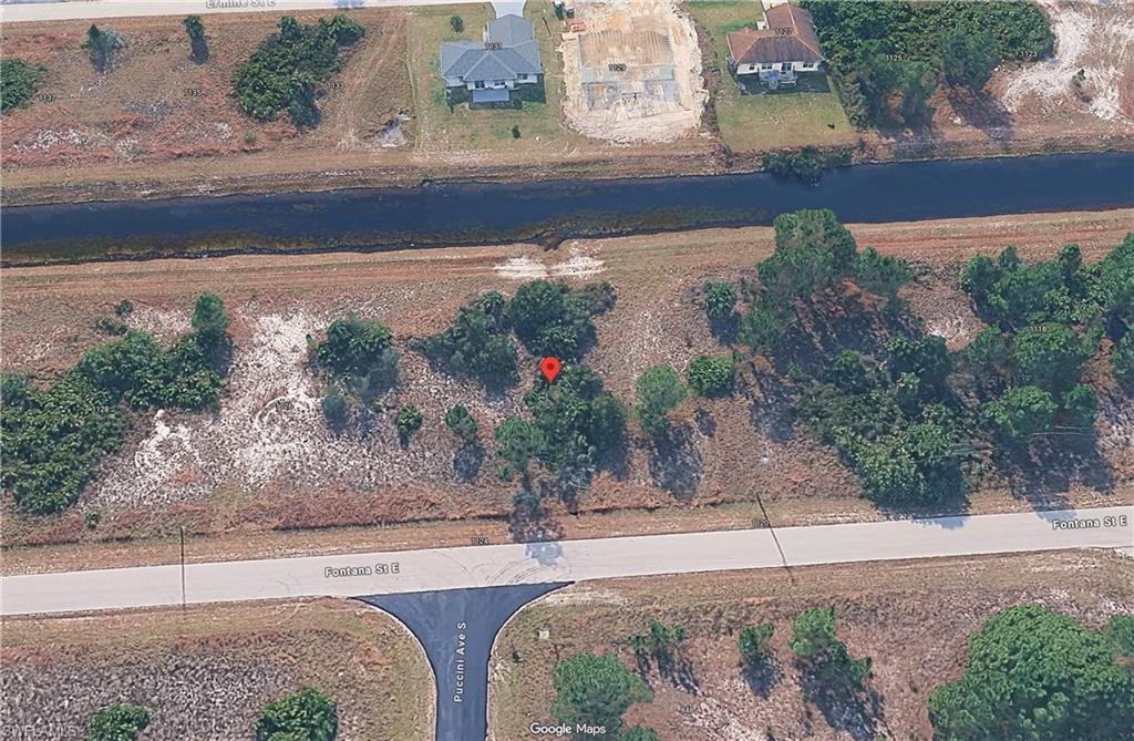 You've just found one of the lowest-priced 1/4+ acre parcels in the desirable southeast area of Lehigh Acres! The seller is offering two side-by-side lots totaling nearly 1/2 acre when purchased together, providing extra space and endless possibilities for your future home. A 50-foot-wide canal behind the property offers added privacy, extra breathing room, and a great spot for fishing. The highly desirable southern rear exposure provides excellent sunlight throughout the day; perfect for designing your dream home with a pool. An electric pole is located nearby for convenient utility connection, and the lot requires very little clearing, helping reduce your building costs. Conveniently located just minutes from elementary, middle, and high schools, golf courses, shopping, and SR-82, you'll enjoy easy access to Fort Myers or head east toward Fort Lauderdale and Miami via Alligator Alley. Whether you're ready to build now or invest for the future, this is an outstanding opportunity. Seller has a total of 8 vacant lots located in S.E. Lehigh that are available in side by side pairs, please see additional remarks for total list of addresses.