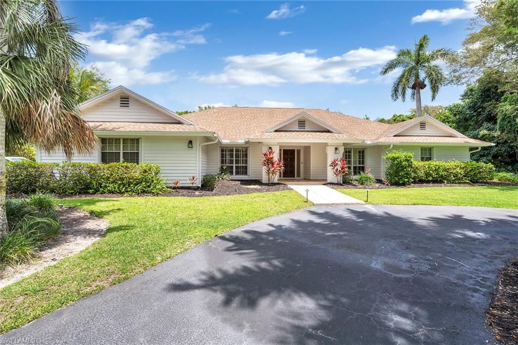 Rarely available in Pine Ridge Estates, 600 Ridge Drive combines immediate livability with incredible future potential for a custom estate. This 1.67-acre homesite with city water is high and dry, adorned with royal palms, offering privacy and serenity. Exuding Naples charm and character, this meticulously cared-for home is a move-in-ready option. The home features a formal living and dining room with high ceilings and a wet bar, a gorgeous primary bedroom and primary bath with natural light, and an oversized walk-in closet. The upgraded kitchen boasts Cambria countertops, many new stainless-steel appliances and a large island for family enjoyment. A family room with a fireplace opens to a large lanai and a heated saltwater pool. Additional features include wood and tile flooring, French doors and plantation shutters. This property offers a unique blend of immediate comfort and the extraordinary potential to build a custom estate tailored to your vision. Create the dream home you’ve always wanted in Pine Ridge Estates, where sandy beaches, world-class shopping and dining, vibrant nightlife, the arts and top-rated schools are just moments from your doorstep.