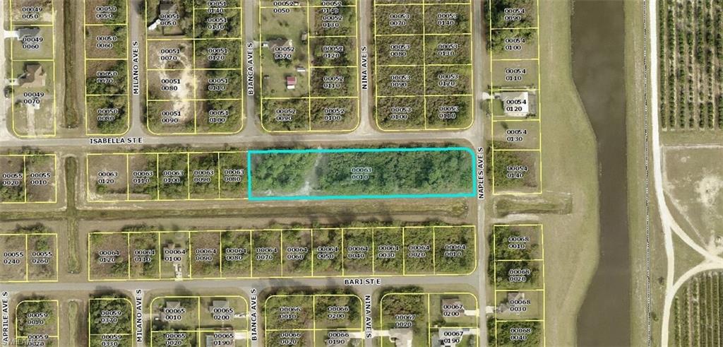 Seven home sites all in a row. Ideal location to build your spec homes. One over-sized corner and six regular sized home sites.  Southern rear exposure with a Lehigh Acre canal in back. Builders; ideal location for spec home building.