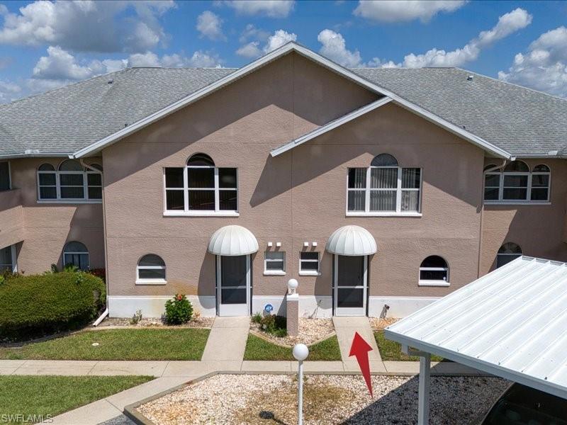 Centrally located to downtown Lehigh Acres where shopping is just walking distance away! Ride the bus which picks up outside the community or walk to The Company storage unit also walking distance.  The medical centers are super close by too and you can spend more time relaxing by the pool or hot tub instead of in your car!!  This beautiful townhouse has vaulted ceilings, large kitchen, a grand size living room and plenty of space for everyone.. This home features a large lanai downstairs and a private lanai off the master. The split floor plan provides privacy from the 2 Bedrooms and each person has their OWN bathroom!!! Scroll through All the tasteful photos and video of this great property and set up a showing NOW!