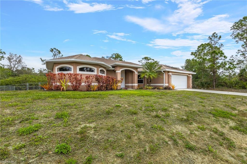 WELCOME HOME!! Must see this open floorpan 3 bedroom plus den pool home. This beautiful home features cathedral ceilings carpet and tiles with a large lanai and pool deck. Plenty of room to enjoy family time or have fun and entertain in your fenced yard. Freshly painted interior A/C unit is less then a year old. The spacious master bedroom offers a large bathroom with a separate stand alone tub and walk in closets. Minutes from Fort Myers and shopping.