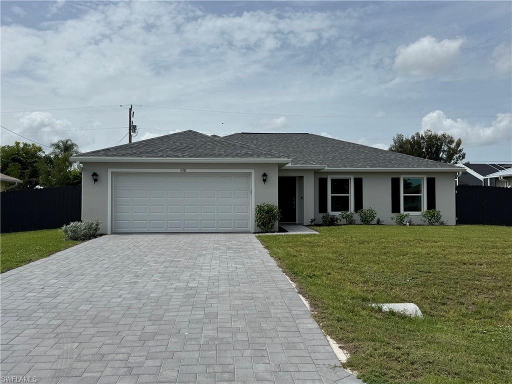 Move-In Ready 2025 Construction on an Oversized Southern Exposure Lot with Paid Assessments and Premium Upgrades! Located in the heart of Southwest Cape Coral, this beautifully designed 4-bedroom, 2-bath Fairfield floor plan offers the perfect combination of new construction, modern upgrades, and exceptional value. Built in 2025, this home features soaring vaulted ceilings, tile flooring throughout, and a bright open-concept layout ideal for both everyday living and entertaining. The stylish kitchen serves as the centerpiece of the home with shaker-style cabinetry, upgraded countertops, an impressive 8-foot island, and a complete stainless steel appliance package. The spacious owner's suite is thoughtfully appointed with custom accent wall details, dual vanities, a private water closet, linen storage, and a large walk-in closet. Both bathrooms showcase upgraded fully tiled showers, adding a luxurious touch throughout. Step outside to enjoy the oversized fenced backyard with desirable southern rear exposure, offering ample room for the pool of your dreams. Additional highlights include a covered lanai, decorative paver driveway, impact-resistant windows and doors, an impact-rated garage door, and a beautifully landscaped low-maintenance yard. Best of all, this property is located outside of flood zones and the water and sewer assessments are paid in full—providing significant savings and peace of mind. With no construction delays, premium upgrades already completed, and a highly desirable central location close to shopping, dining, schools, and entertainment, this home stands out as one of the smartest buying opportunities on the market today. Schedule your private showing and experience the difference for yourself.