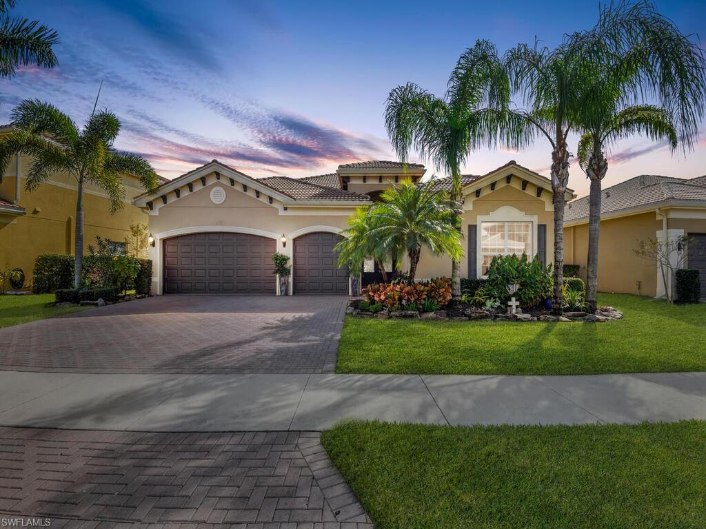 The Wow Factor! 3 bedrooms + a den, 3 bath home with a 3 car garage set on a large lot in desirable Marbella Lakes. The perfect private location with custom landscaping facing the lake with Southern exposure to enjoy year round Gulf Coast sunsets.  The backyard is a little slice of paradise- relax in your own custom pool with a tranquil travertine rock waterfall set into a paver patio in a screened lanai and fenced in yard. This well appointed home has an open floor plan, vaulted ceilings, crown moulding, custom painting, hardwood flooring, and tile throughout.  The upgraded eat in kitchen is open to the living area enjoyable for daily living and entertaining. Hurricane Windows and doors with shutters, newer front door and updated HVAC system. The best of both worlds- you can enjoy your spacious home and backyard oasis or experience everything Marbella Lakes has to offer- an incredible 8000 sq ft lifestyle center with an indoor sports complex, fitness center, clubhouse, resort style pool, basketball and tennis courts with year round social activities and events all for only $967/quarter which includes lawn maintenance and 24/7 security.
