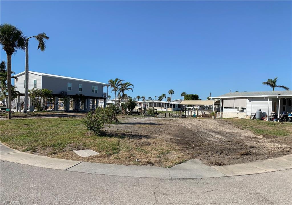 Priced to sell! Very Large corner lot available in Bayside Estates with DIRECT GULF access. New Seawall in 2009, this lot offers added value and peace of mind! This lot has plenty of room to accommodate a pool home with a garage. Just a short boat ride, or bike ride to FMB. Bayside Estates is a sought-after 55+ boating community close to everything that's fun in the sun. We have the expertise and resources to help you build your dream home in paradise.
From trusted builder introductions to financing options, insurance providers, and more — we’re here to guide you every step of the way. Amenities include, Bocce court, Clubhouse, Community pool, Community room, Exercise room, Internet access, Library, Pickleball, Shuffleboard, Sidewalk, Tennis Court, Underground utility. Maintenance includes, Internet, Irrigation, Lawn/Land, Manager, Rec Facilities, Sewer, Street lights, Trash removal and water. The community Clubhouse & Office now have a water barrier planking system up to 31” High & Cool Seal waterproof insulated paint. HOA fees are $650 a quarter. Buyers pay a $2600 capital contribution fee .