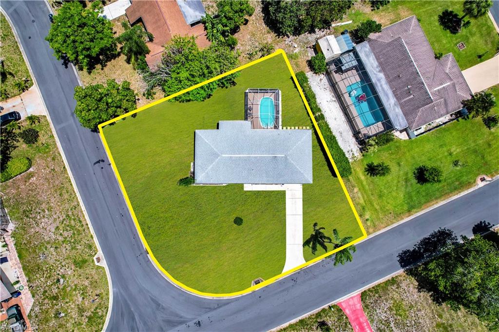 OVERSIZED CORNER LOT w/ single family pool home! Amazing opportunity to own your own home in paradise. Situated in a non-gated neighborhood that has little restrictions and NO HOMEOWNER ASSOCIATION FEES. Unusual parcel with plenty of space for playset, trampoline, and/or rv/boat parking. This home offers a wonderful open concept living design, split bedroom floor plan, spacious kitchen w/ dining area & eat-in nook, master bedroom w/ huge walk-in closet that features wood shelving, 1 car extended garage, and covered sitting area on lanai, and screened in heated pool. Very convenient location- easy access to Alva & to Fort Myers, short drive to the park setting of Franklin Lock & Dam, and only 6 minutes from the massive Veterans Park Recreation Center where there are activities for every member of the family!
