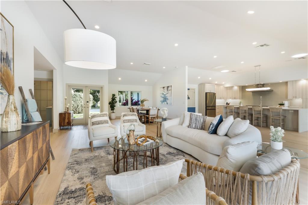 This waterfront property is ideally positioned on a navigable waterway with idyllic views of Outer Clam Bay and direct access to the Gulf of Mexico. The modernized floorplan was designed by MHK Architects in 2014 & was  renovated in 2023.  This single story residence features an open chef’s dream kitchen with a large center island, 48” induction range, large great room, 4 bedrooms, 3 bathrooms, impact resistant doors & windows, vaulted ceilings, hardwood floors & lovely earth tones to set the tone for relaxation and entertaining. A private “beach” &  boat dock offers 100 feet of water frontage and a great place for kayaks. Private outdoor lounge areas, covered dining and an outdoor kitchen allow for seamless indoor/outdoor living. Seagate is the ultimate neighborhood where you can live in a tropical environment w/ beautiful wildlife, yet be in walking distance to shopping & dining at Venetian Village & Waterside Shops. SeaGate Elementary, Gulfview Middle & Naples High School. Residents may choose to join the private Seagate Beach Club, which offers a pavilion, barbecue grills, changing rooms and parking. Natural Gas is available at the end of the street.