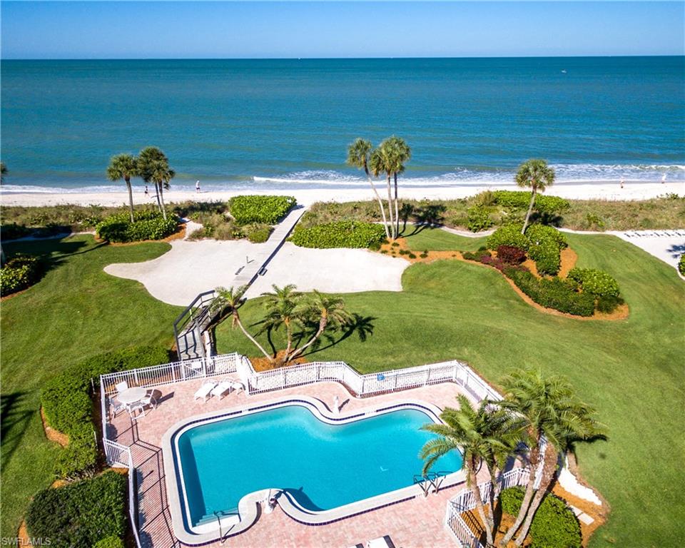 Enjoy endless beach views from this recently-constructed North Naples home. This residence is located in Collier County’s premier waterfront gated community of Barefoot Beach, only steps to the sand and turquoise waters of the Gulf of Mexico, beachfront pool, and “The Club at Barefoot Beach.” This 4,700+ square foot home offers a generous open floor plan with 5 beds, 5.5 baths, and exceptional use of space—all built around the endless Gulf views. Delight in the finest craftsmanship imaginable including concrete block construction, hurricane impact
glass, and automatic shutters and screens. No details overlooked with a private elevator, wood-accented volume ceiling features, designer lighting features, zoned audio system, and programmable lighting system. Gourmet kitchen features a gas Wolf cooktop, granite and wood countertops, hardwood flooring, a large granite island, stunning custom cabinetry, and breakfast nook. Luxurious master retreat offers breathtaking ocean views, a large private lanai, sitting area, wetbar, and spacious bath featuring an oversized walk-in marble shower and
soaking tub. Each of the four spacious guest suites includes a private bath and private balcony.