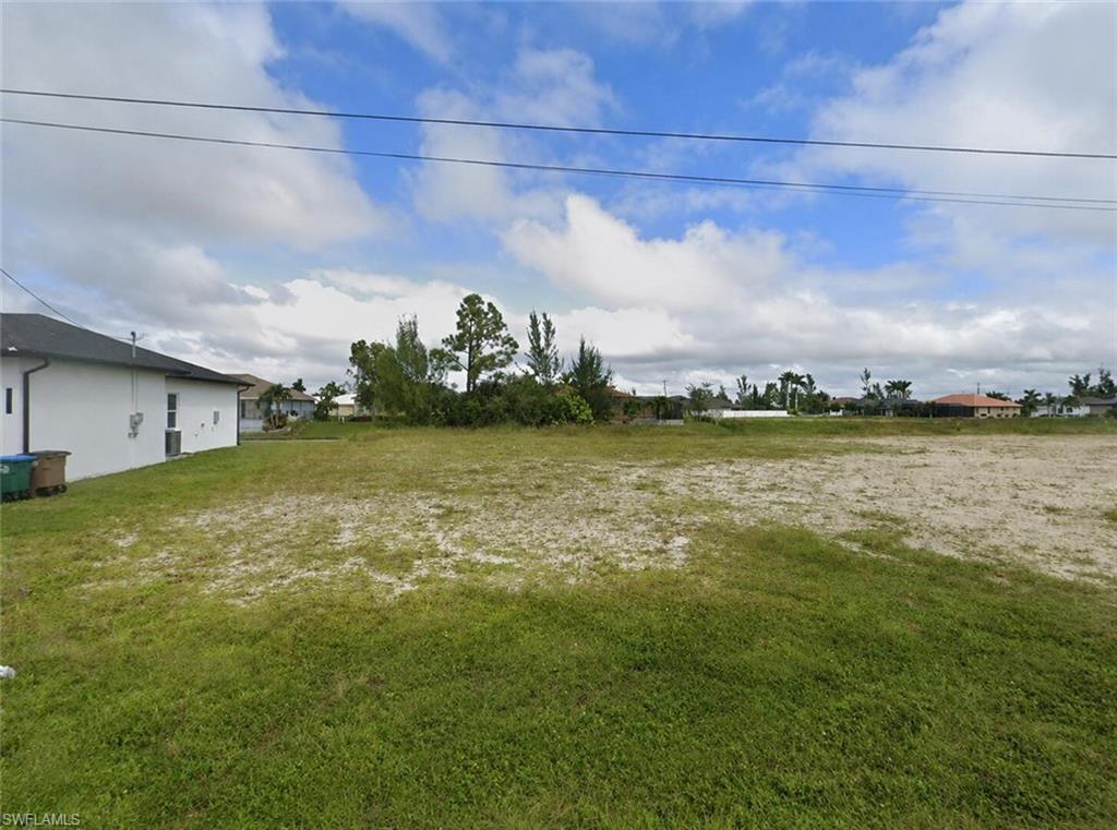 Cleared freshwater canal lot in a desirable Cape Coral neighborhood. 10,019 SF homesite with city water and sewer available. Flood Zone X and all assessments paid in full. Electric available at site. Conveniently located near shopping, dining, schools, and parks. Surrounded by newer homes and ongoing development. Excellent opportunity to build a custom home or investment property.