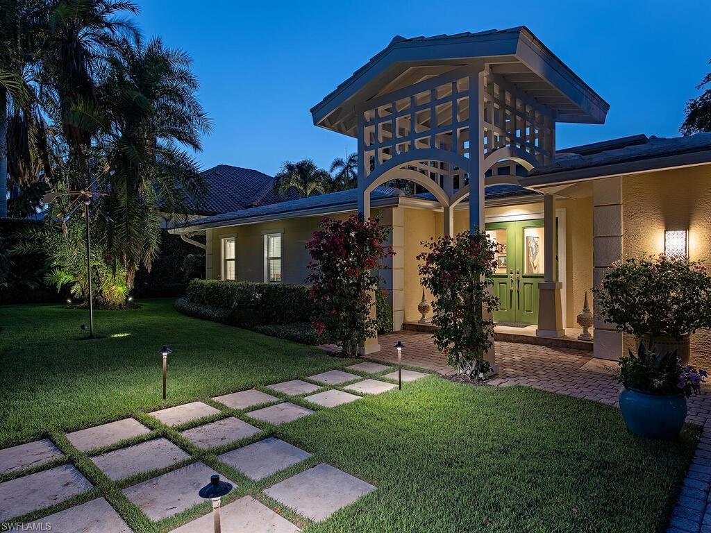 H2269 - Enveloped by tall hedges and nestled on Naples' most prestigious street lies an impeccably maintained residence that affords nearly every Buyer's desires.  Over 3,100 square feet of thoughtfully designed living space has gone under extensive renovations within the last ten years and offers 3 bedrooms, each with an en-suite bathroom, a loft that creates the ideal office space, as well as a generously sized kitchen which seamlessly opens to the light and bright family room boasting 15' soaring ceilings.  Beyond the main living space's French-doors, dream-like entertaining can be had surrounding the pool, or a quiet lunch can be enjoyed in the side yard hosting a variety of fruit trees and a stone pond.  Merely one block from sugary white sand beaches and a short stroll to all of Downtown Naples has to offer, this makes for the ideal Naples retreat!