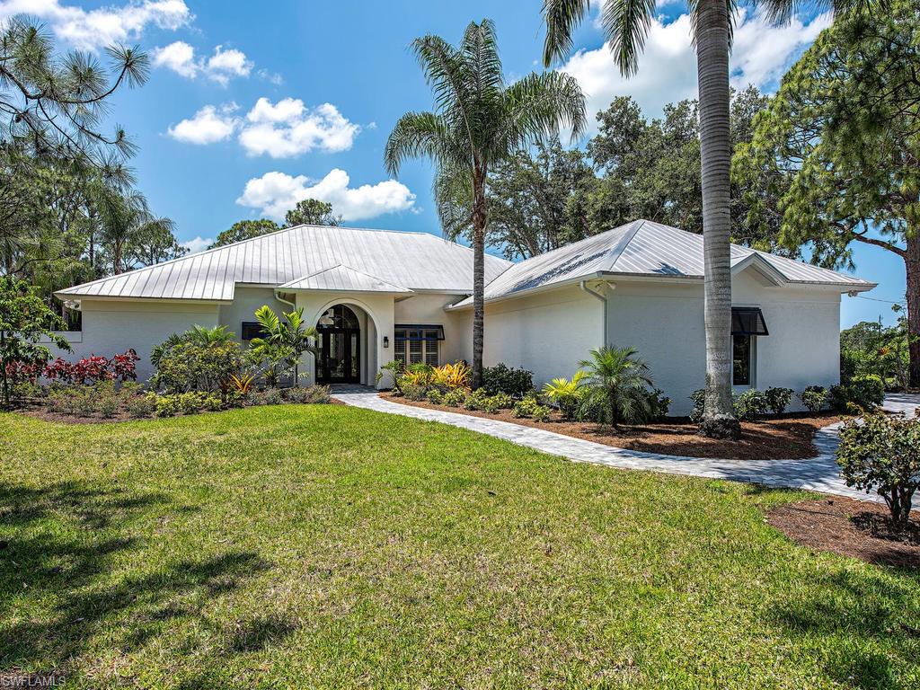 Feel at home the minute you walk into this bright and open 5 bedroom plus den 4.5 bathroom home. Located on a corner 1.47 acre lot this home has so much to offer. Recently renovated with wonderful updates. Home has  chestnut hardwood floors throughout and volume ceilings. A wonderful home to entertain in and equally wonderful for day to day living. The chef of the house will love the well-appointed gourmet kitchen with loads of cabinets and fabulous stainless appliances. The master bedroom suite is a fabulous retreat with his & hers closets and a luxurious bathroom. There is room for everyone with 4 more bedrooms–there are many places to gather together. Wander outside to the oversized lanai and relax in the pool. Steps away is a 2BR 2BA guest house nestled on the property. A total of over 5600 square feet of a/c space-4264 main & 1338 guest house. This home offers a perfect balance of privacy, elegance and comfortable living. All this in a wonderful location. Pine Ridge is close to Mercado, Waterside Shops, fabulous restaurants & shopping, beaches - near everything that you want and need. A wonderful lifestyle awaits you in the much sought after neighborhood of Pine Ridge Estates.