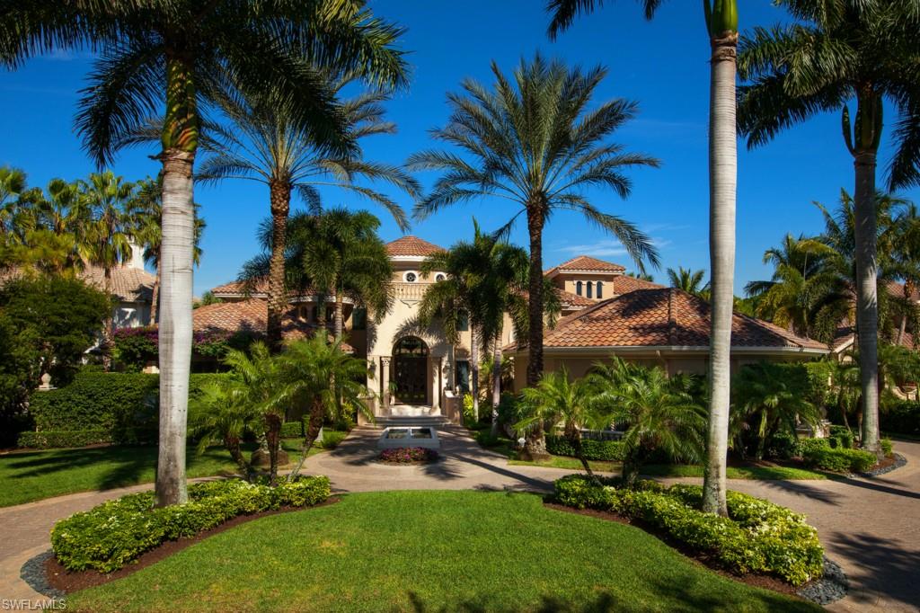 Beautifully and masterfully designed with impeccable craftsmanship throughout.  Stunning Harwick home features four bedrooms, den, resort-style pool and spa, elevator, an impressive kitchen and open entertaining area with sliding glass doors that open to the your picturesque lake and golf views from your covered veranda and summer kitchen complete with outdoor fireplace. The custom wood crown moldings, intricate detail in coffered and tray ceilings, 1000 bottle wine cellar with cedar storage, faux finishes, groin vault ceilings, Chenet stairs with Brazilian cherry staircase, marble floors, renaissance collection vineyard wood etched wine door, Sub-Zero refrigerators, 500 gallon propane for chef's delight, generator, hurricane protection, grand circular driveway with an entry fountain to greet guests.  Shows like a model and maintained impeccably. This home combines the perfect balance of comfort, luxury and technology in tropical paradise.