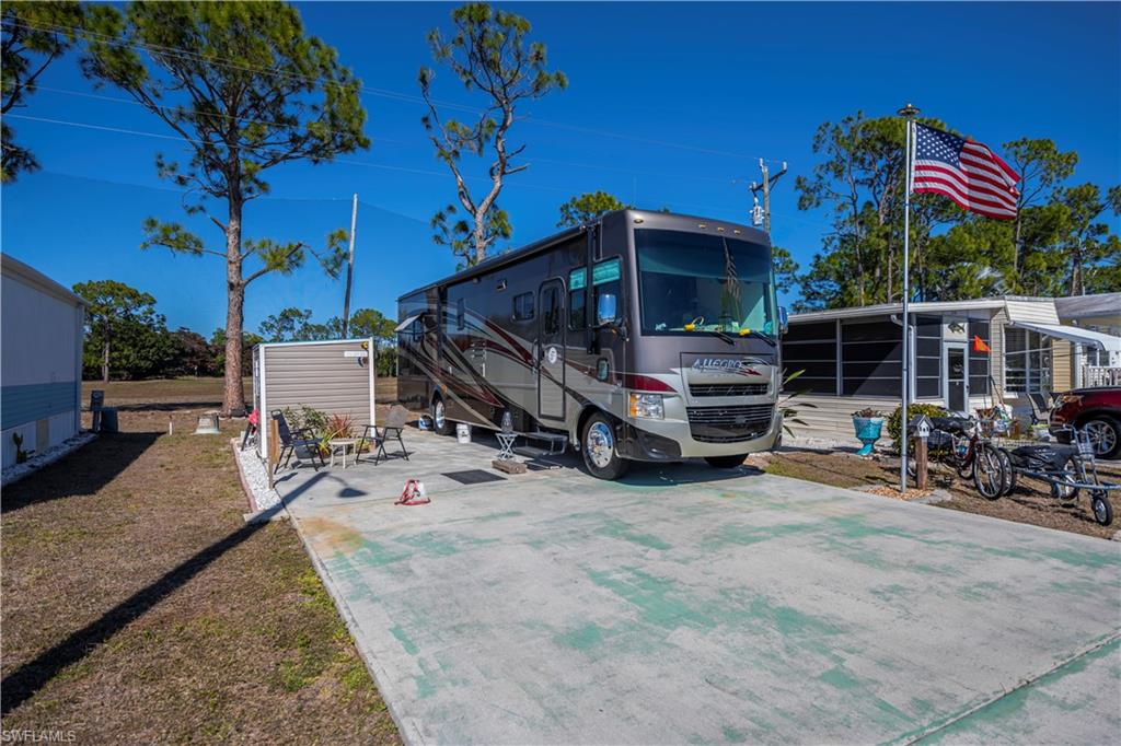 Build or park with confidence on this well-located deeded RV lot in Fountain View RV Resort, a well-established and professionally managed 55+ community.  Lot #243 offers approximate dimensions of 36’ x 62’ x 35’ x 62’ and features a north-rear facing back-in concrete pad, ideally positioned near the clubhouse while backing to wooded privacy and the community golf driving range.  The lot is fully improved with cable, water, sewer, and 50-amp electric service, and can comfortably accommodate up to a 38’ RV, including Class A, Class C, Super C, fifth wheels, or a permanent manufactured home (subject to community and local guidelines).  A key value-add is the new 6' X 8' - 48sq.ft. permitted, hurricane-rated strapped shed, complete with washer/dryer and additional storage space—an uncommon and highly desirable improvement.  Residents enjoy an active lifestyle with amenities including a clubhouse, community pool, spa/hot tub, bocce, shuffleboard, tennis, volleyball, basketball, and more. Optional RV and boat storage is available. Low HOA fee of $264.50/month includes lawn and land maintenance, on-site management, and use of recreational facilities. Conveniently located just minutes from downtown Fort Myers, shopping, dining, medical facilities, golf courses, and Southwest Florida beaches.  An excellent opportunity to secure deeded land ownership and enjoy the Florida lifestyle.